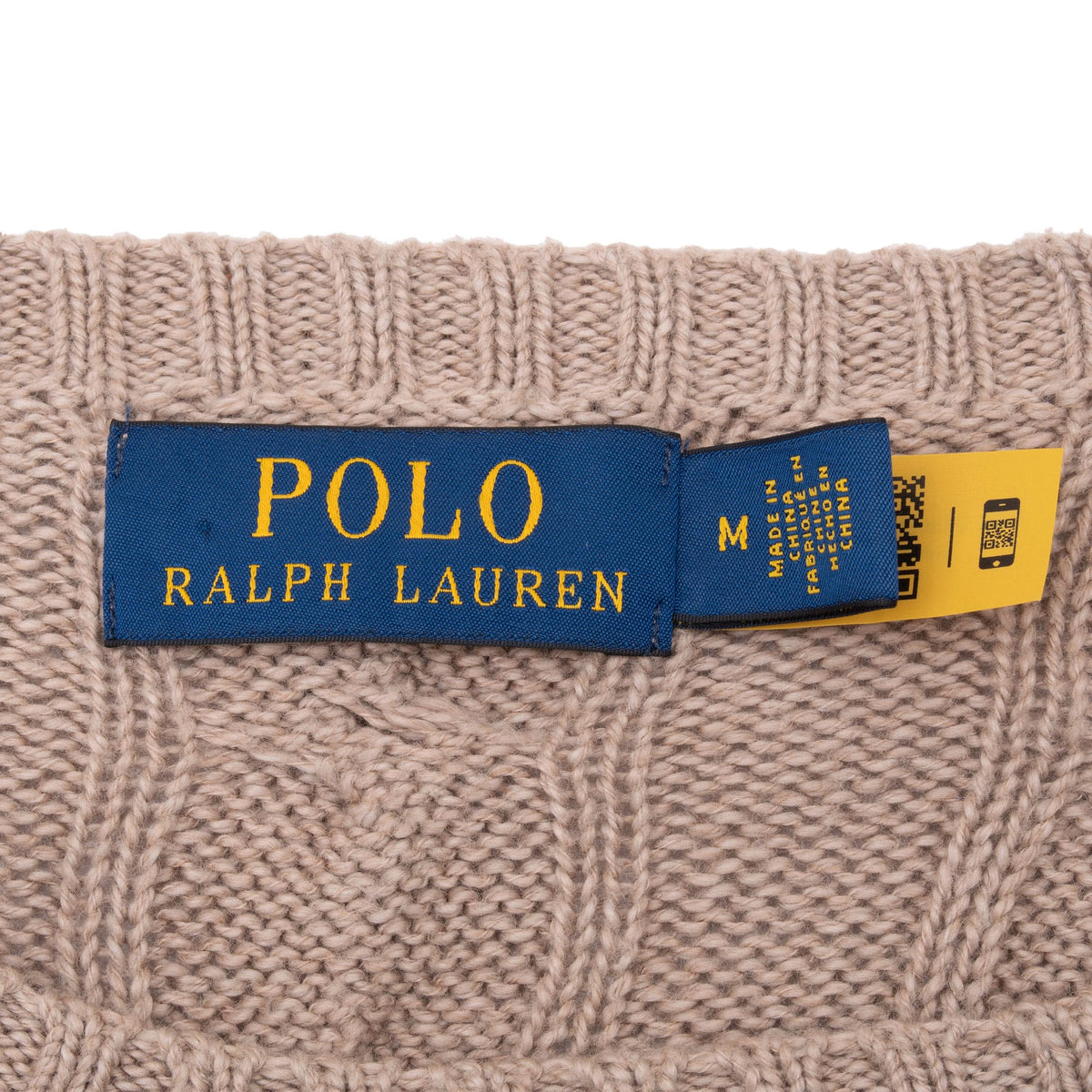 Polo Ralph Lauren neck label and medium size tag on beige cable-knit sweater