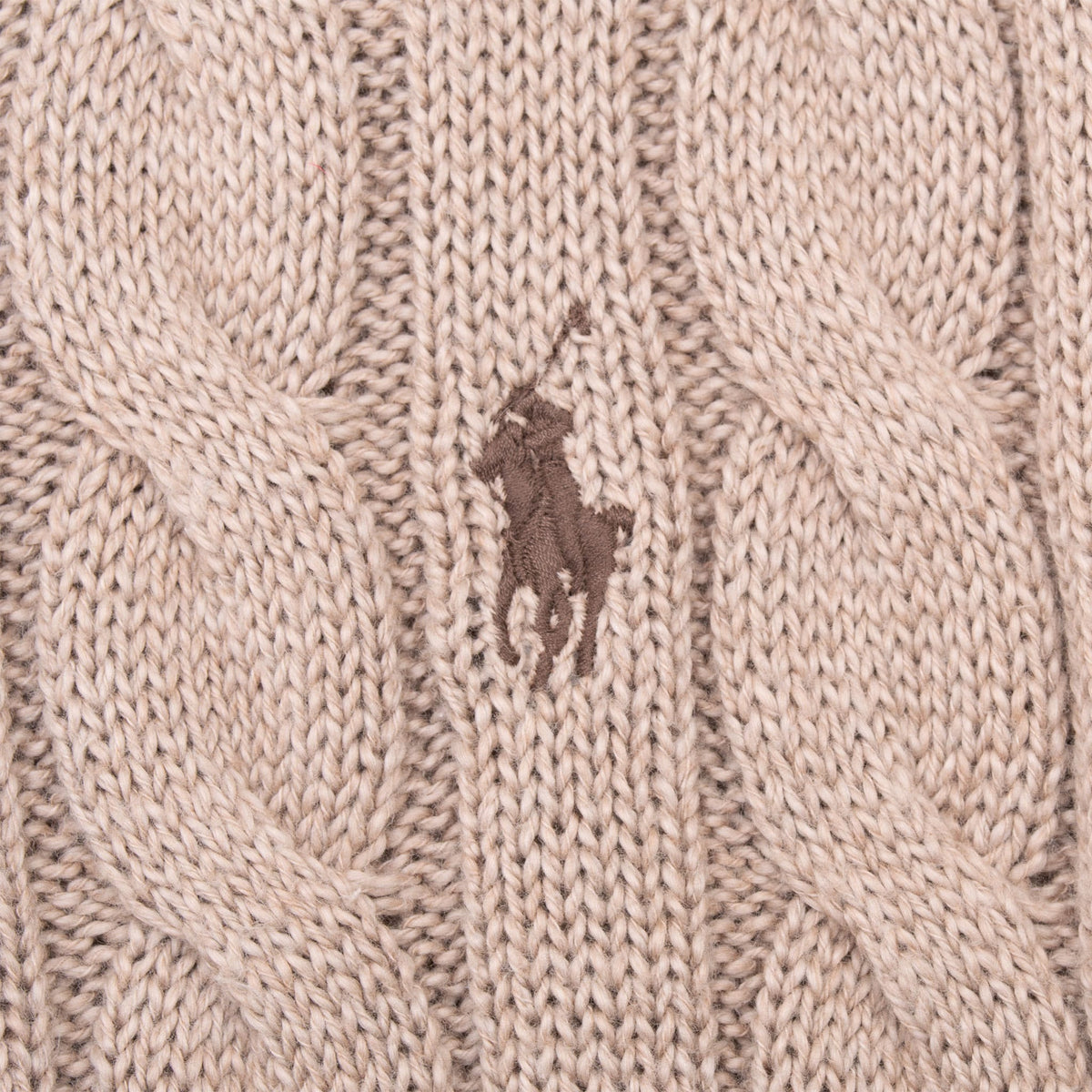 Brown Polo pony embroidery detail on beige cable-knit sweater
