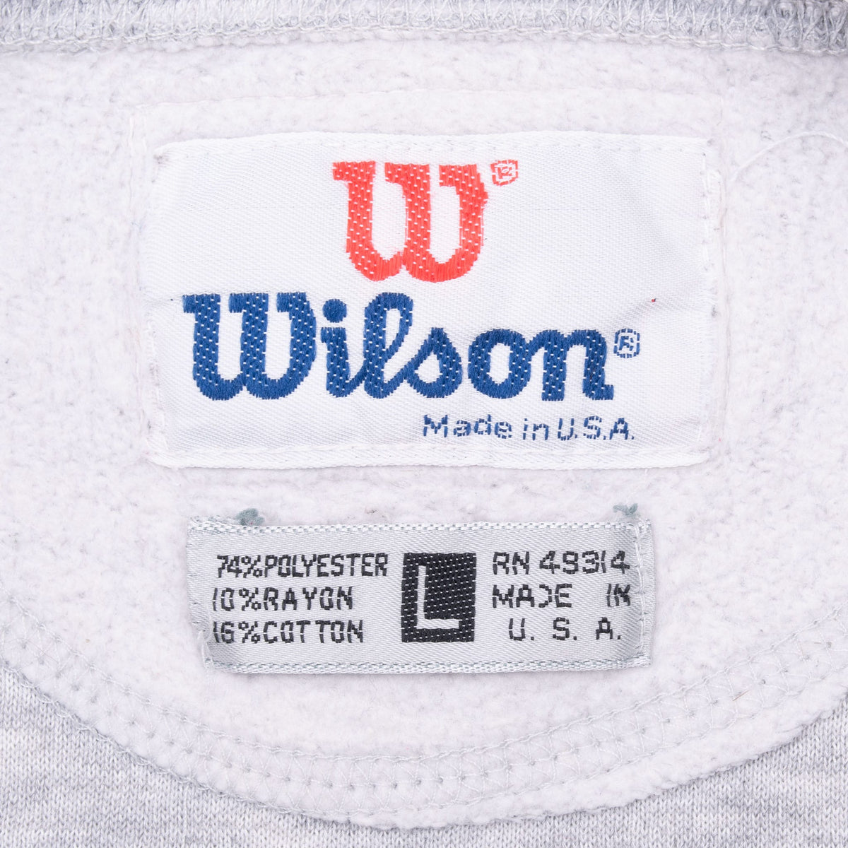 Close-up of Wilson neck and size L tags marked Made in USA