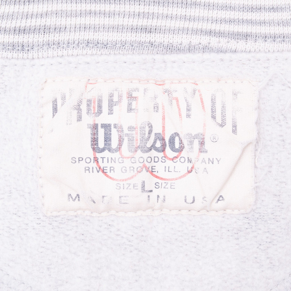 Close-up of faded Gear for Sports by Wilson neck label