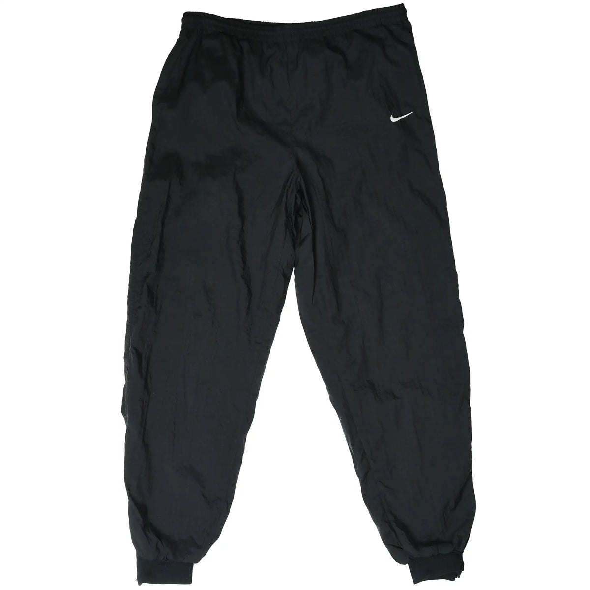 Front view of black Nike track pants with white Swoosh embroidery and elastic cuffs