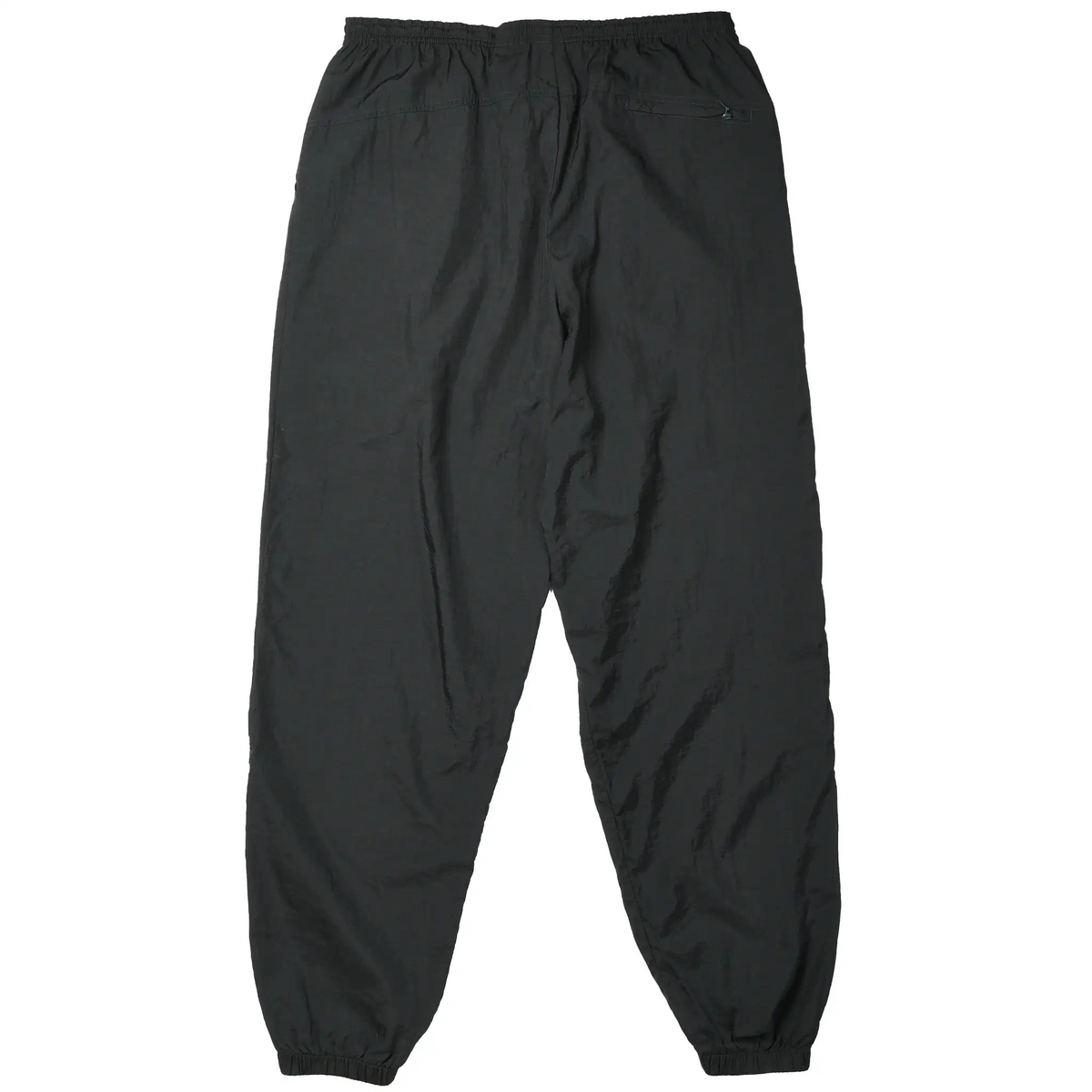 Back of black Nike nylon track pants with elastic waist and cuffs