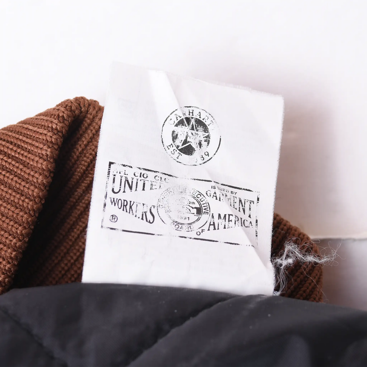 Close-up of union workers label inside the Carhartt vest collar