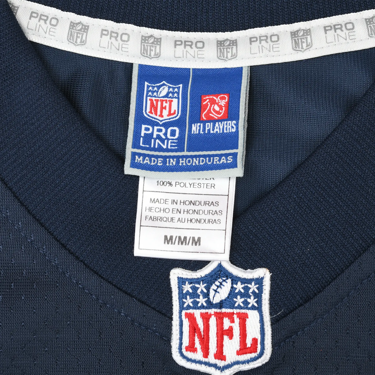 NFL Pro Line medium neck label and embroidered NFL shield on navy jersey