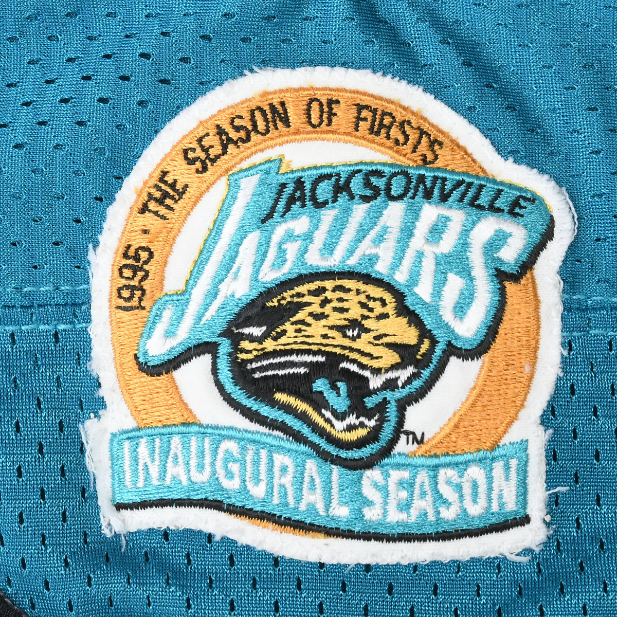 Jacksonville Jaguars 1995 inaugural season embroidered patch on teal mesh jersey