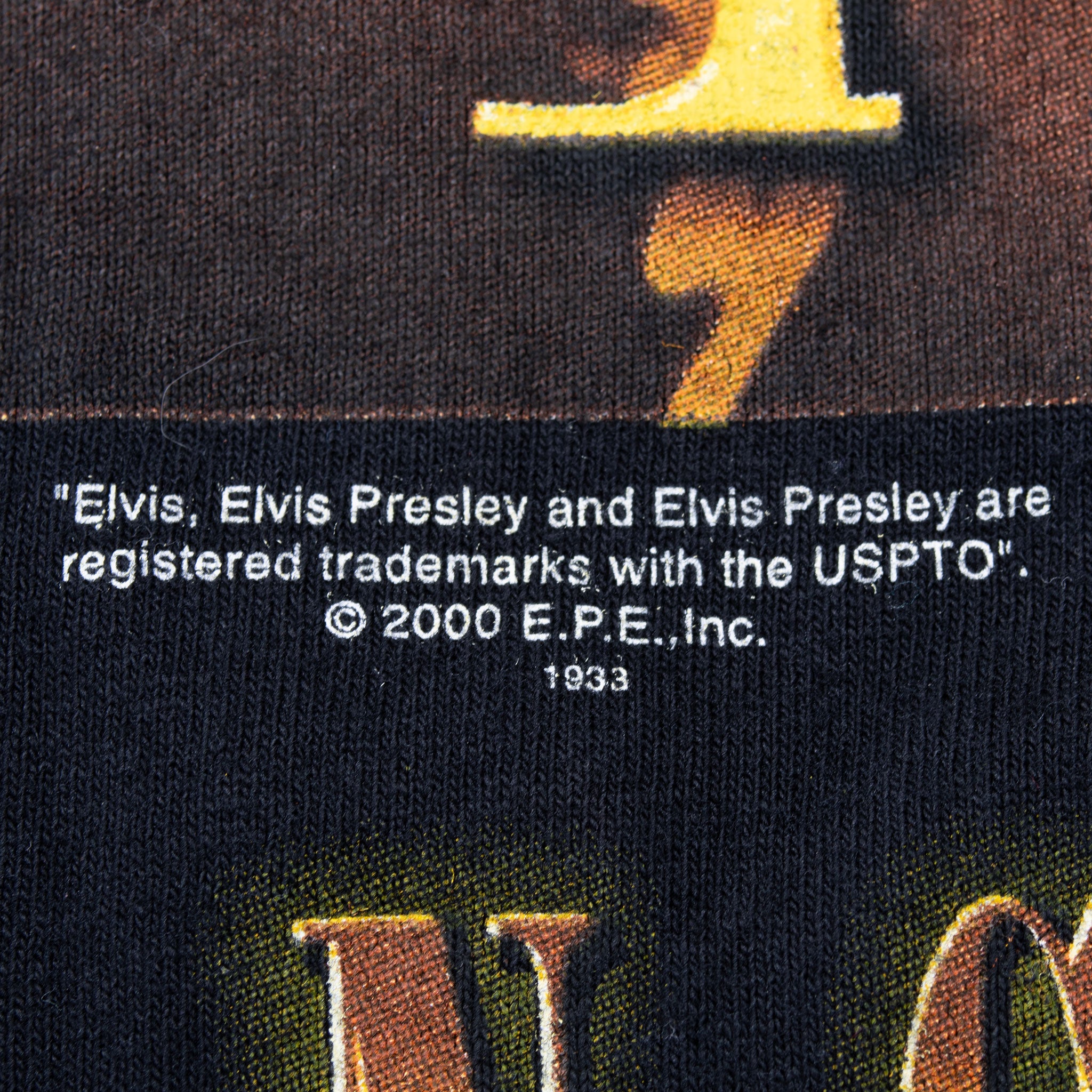 Close-up of Elvis Presley graphic copyright text dated 2000