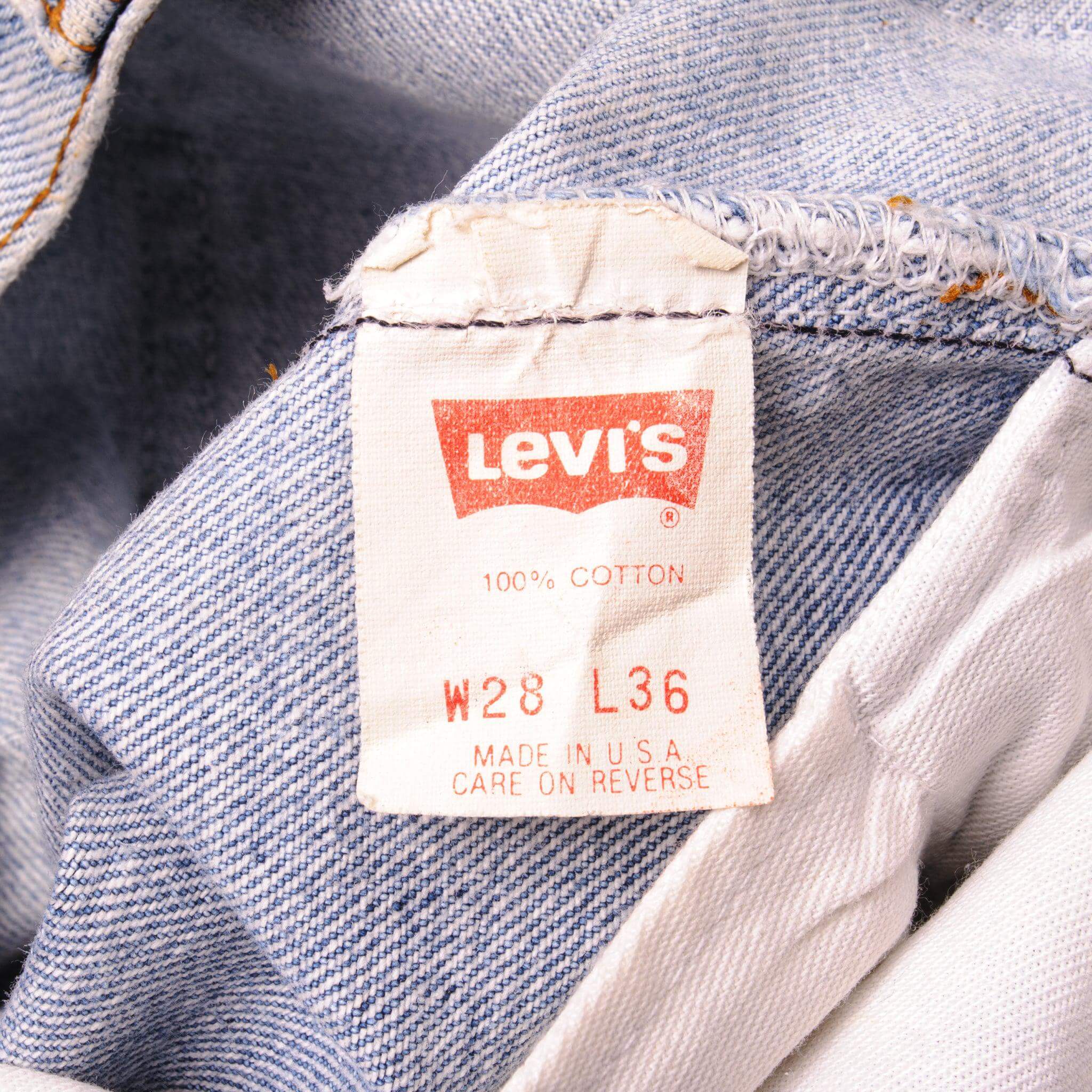 Beautiful Indigo Levis 501 Jeans Made in USA with a light blue wash and a nice contrast of light blue and very light blue. Size on Tag 28X36 ACTUAL SIZE 27X29 Back Button #555