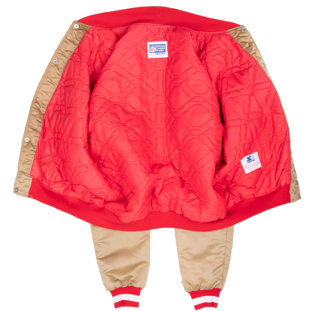 Open San Francisco 49ers Starter jacket showing red quilted interior lining and labels