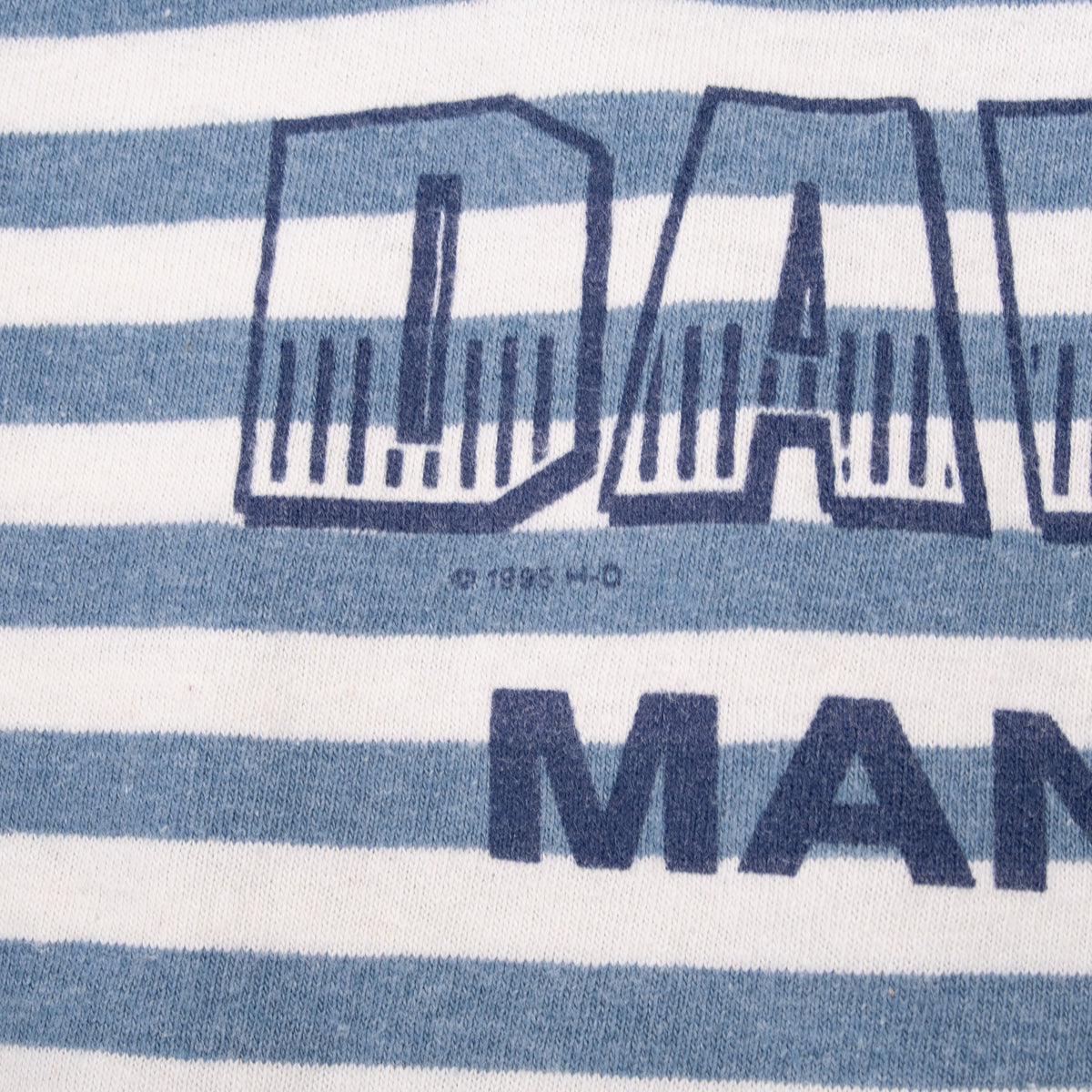 Close-up of 1995 H-D copyright mark beneath the back print