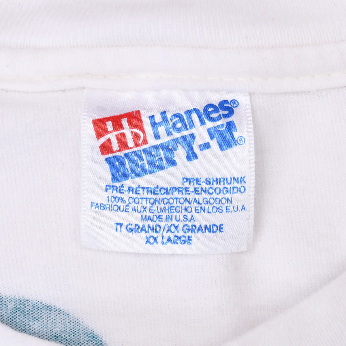 Close-up of Hanes Beefy-T neck label marked XXL, 100% cotton, and made in USA