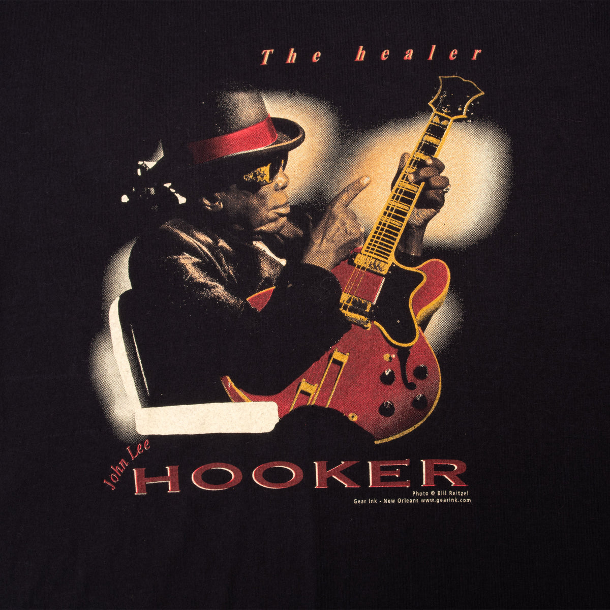 John Lee Hooker The Healer front graphic showing him holding a red guitar