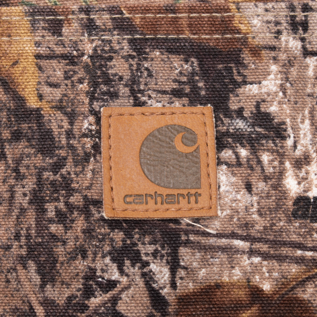 Carhartt logo patch on the Realtree camouflage pants