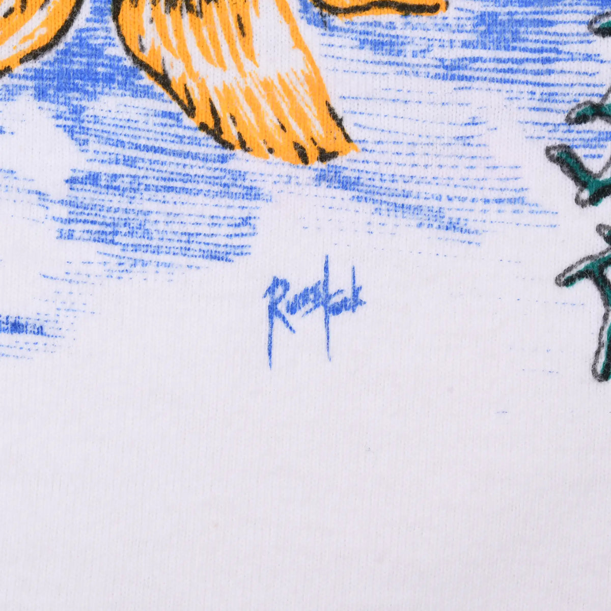Close-up of Russ Tock artist signature in blue beneath the underwater graphic
