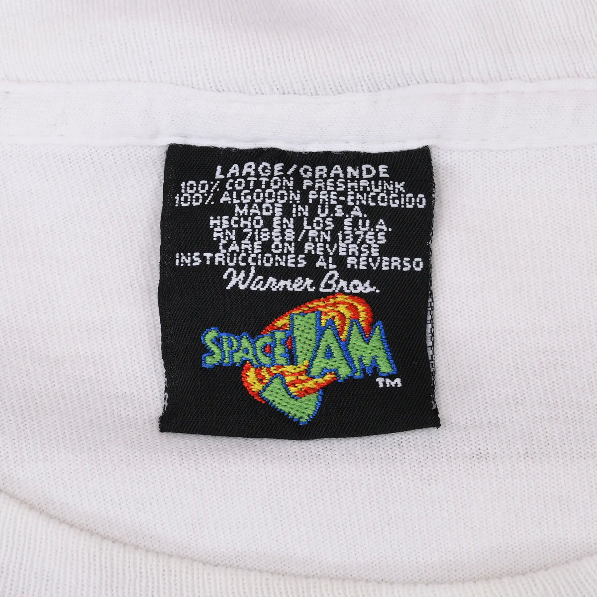 Close-up of Warner Bros. Space Jam neck tag marked large