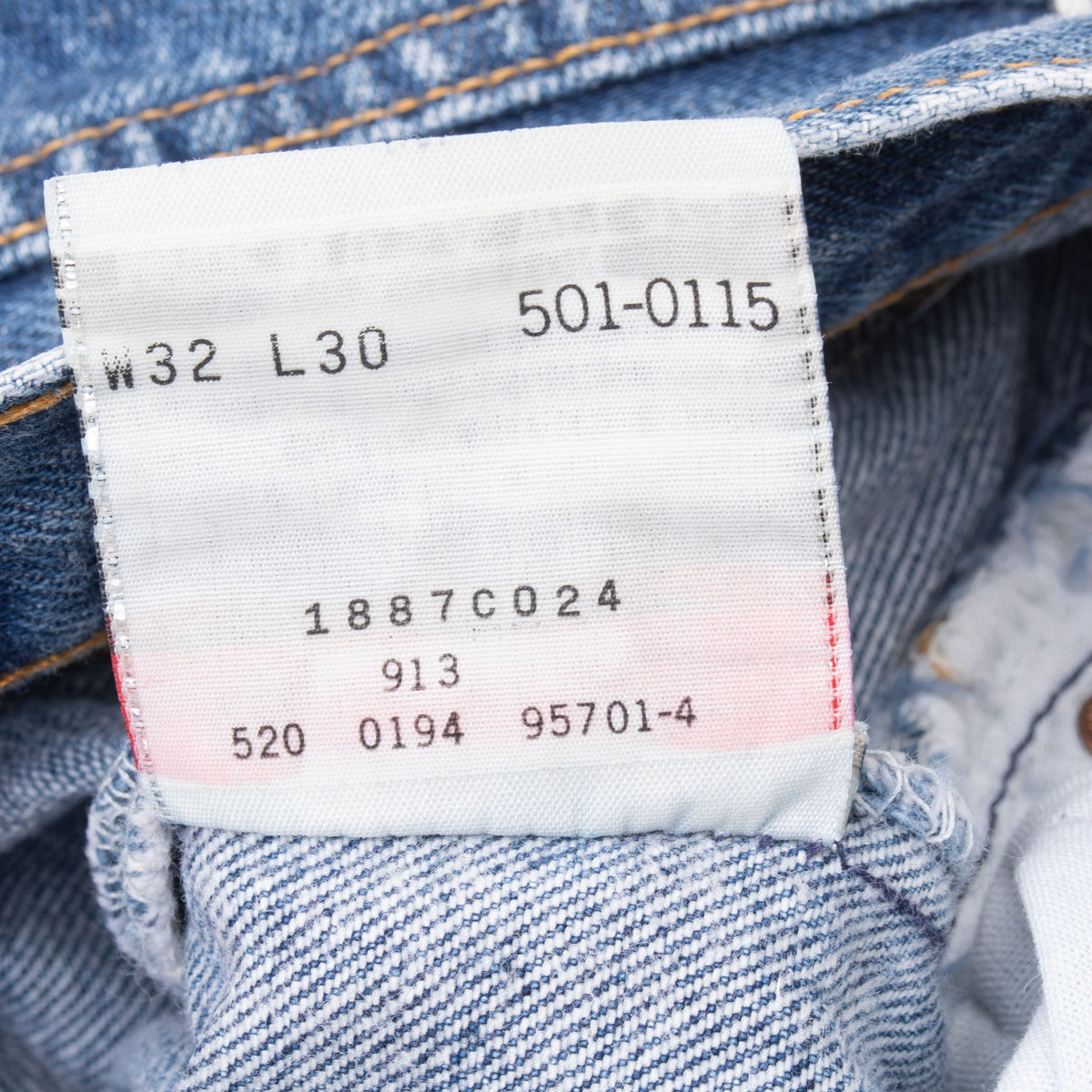 Levi's 501-0115 inner tag showing W32 L30 and factory code 520
