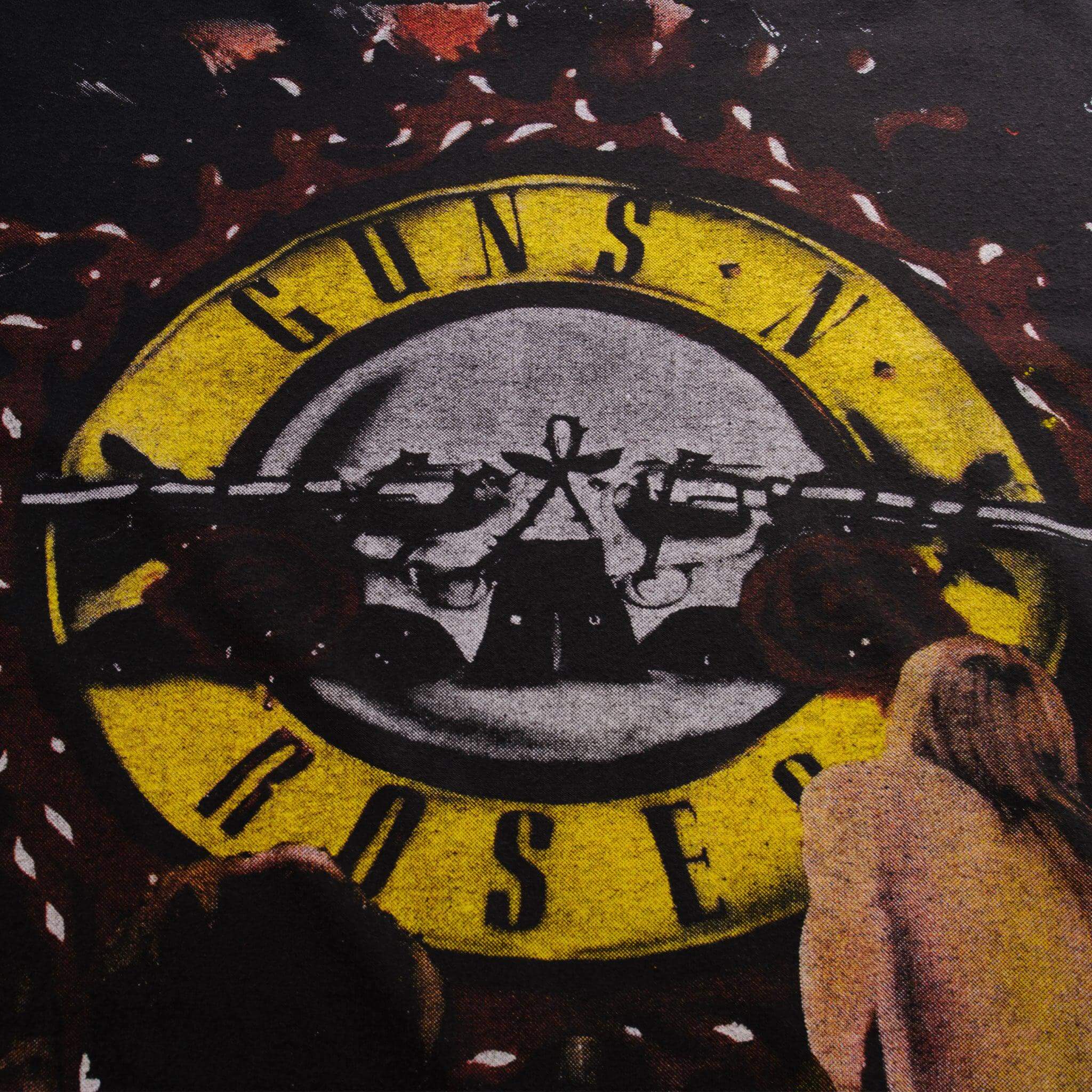Close-up of Guns N' Roses logo and concert imagery on the back print
