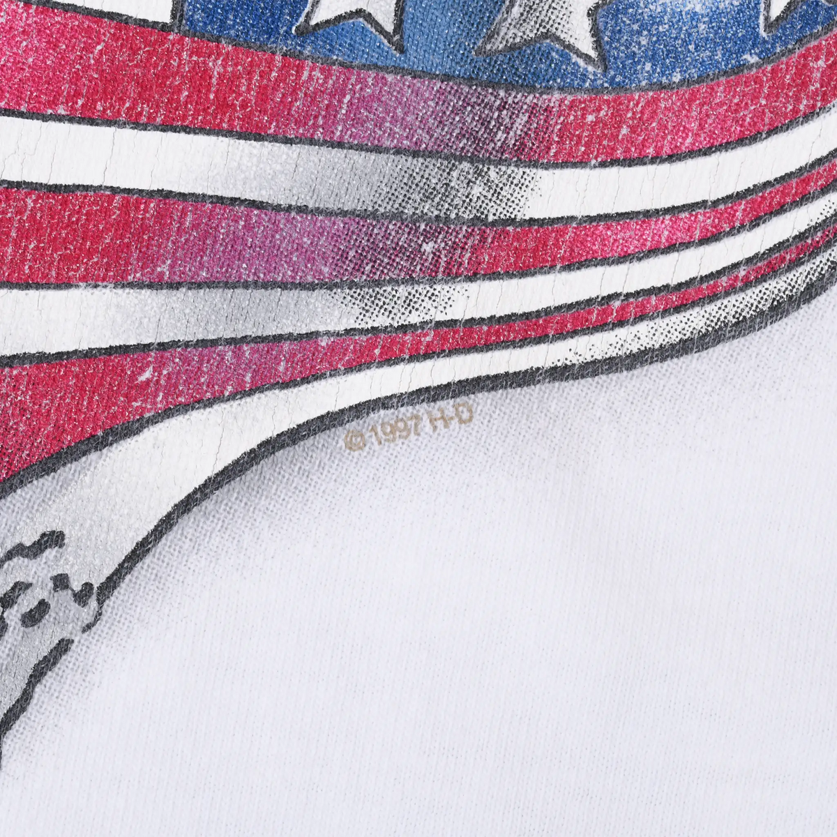 Close-up of the 1997 copyright mark beneath the red, white, and blue flag print