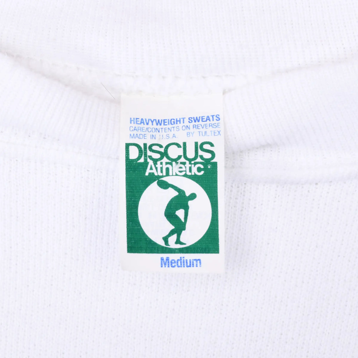 Discus Athletic Medium neck tag on white sweatshirt