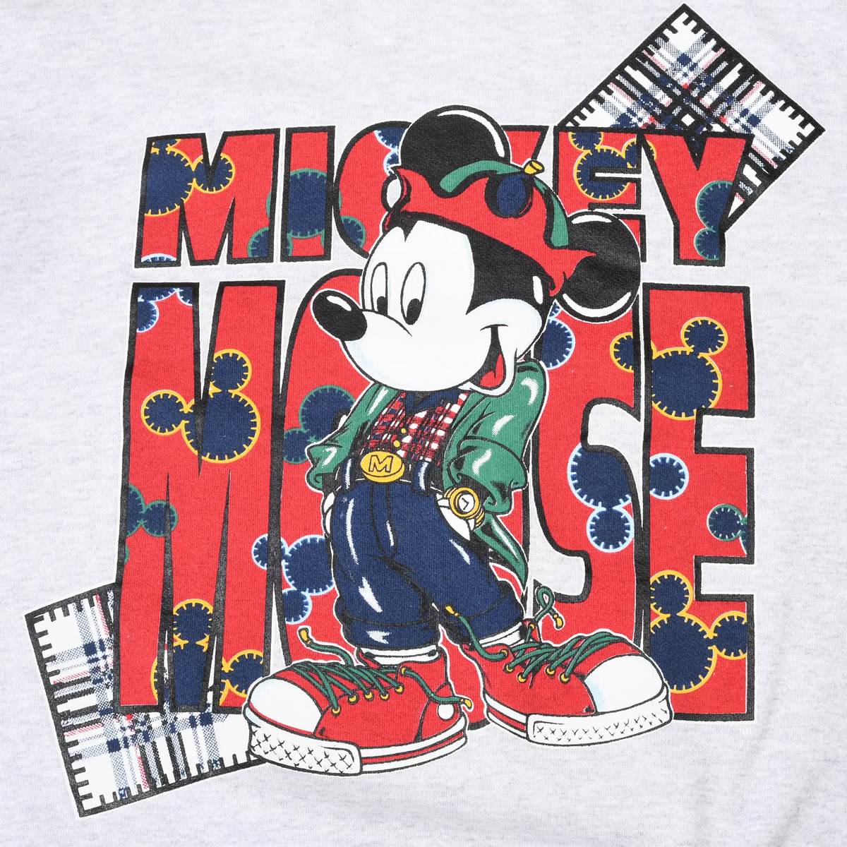 Close-up of colorful Mickey Mouse front print with red lettering and plaid accents