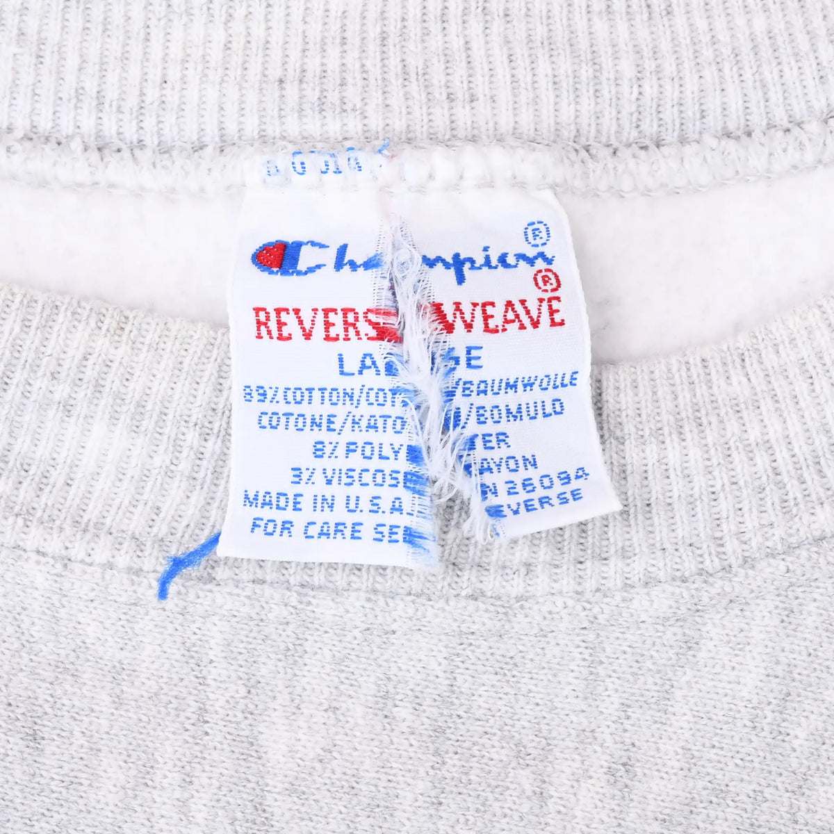 Close-up of Champion Reverse Weave neck label inside gray sweatshirt
