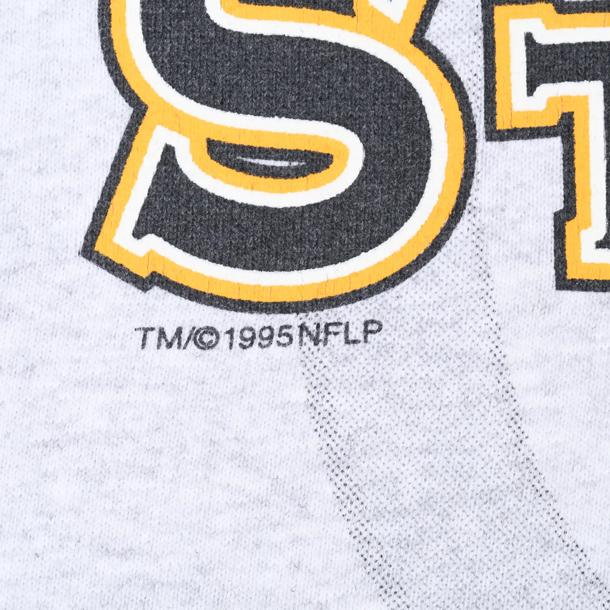 Close-up of 1995 NFL copyright mark beneath Pittsburgh Steelers chest print