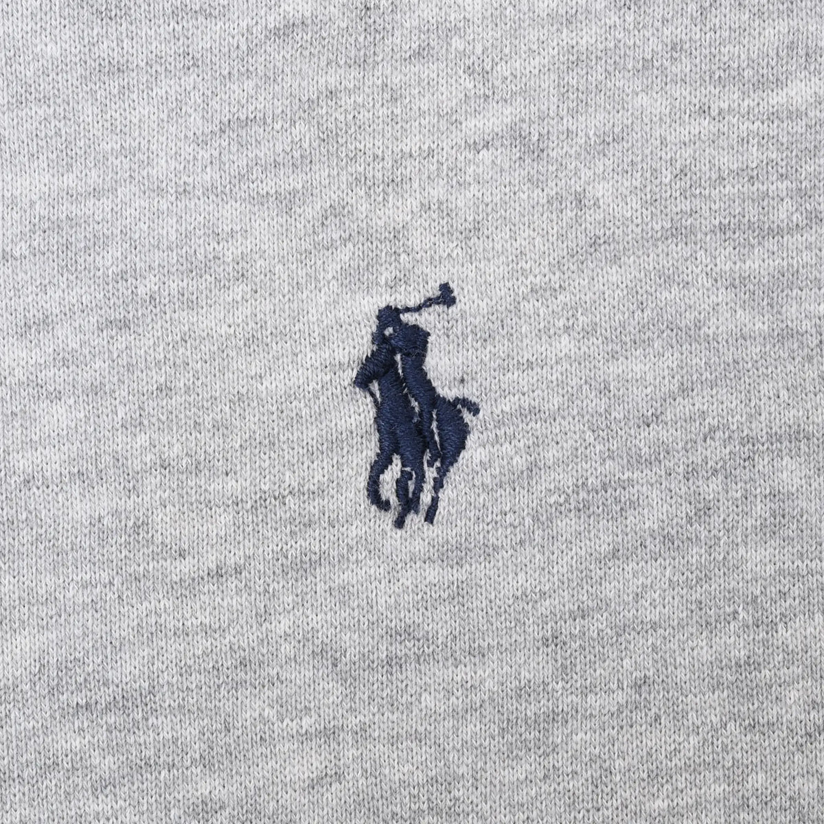 Close-up of navy Polo pony embroidery on grey sweatshirt chest