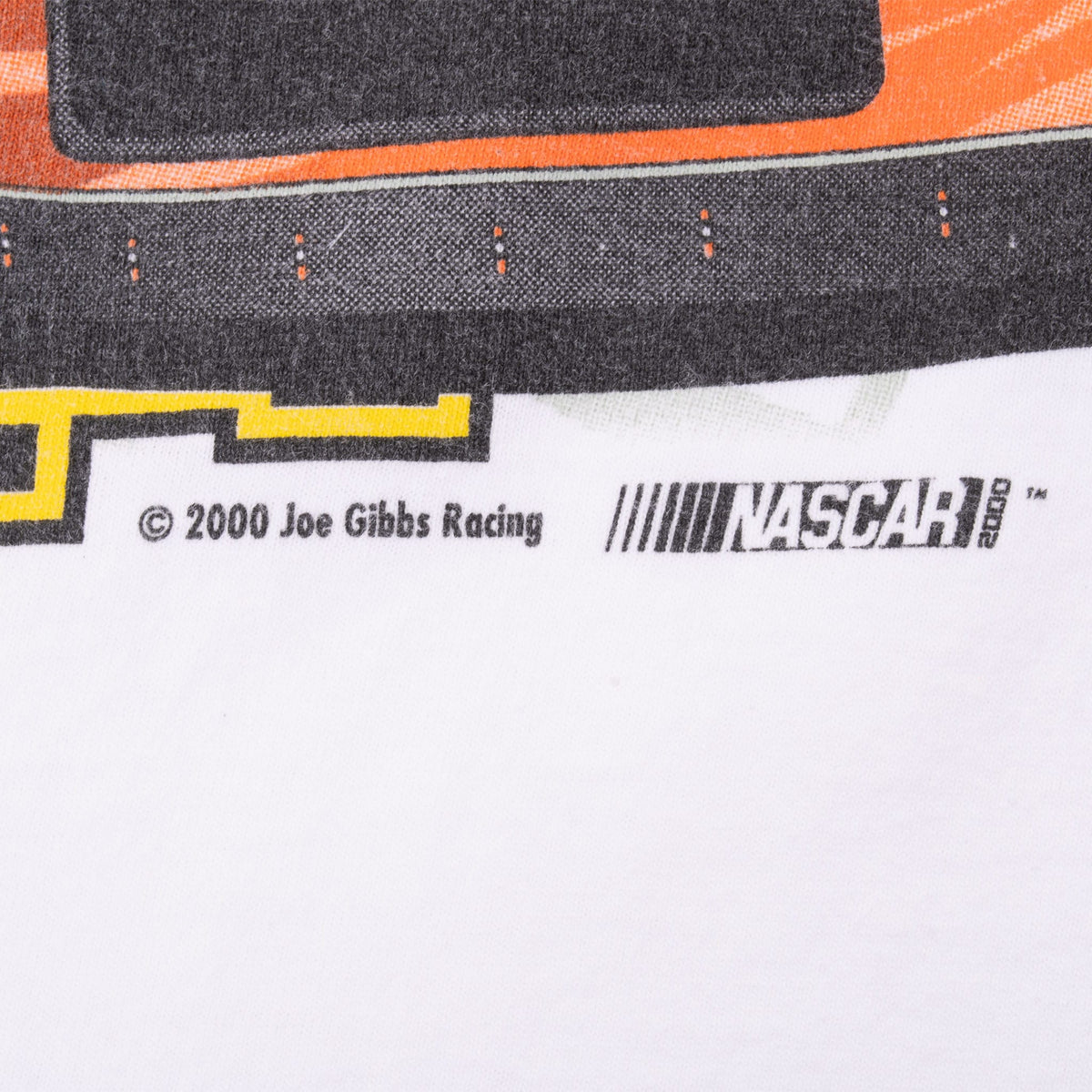 Front print detail showing 2000 Joe Gibbs Racing copyright and NASCAR logo