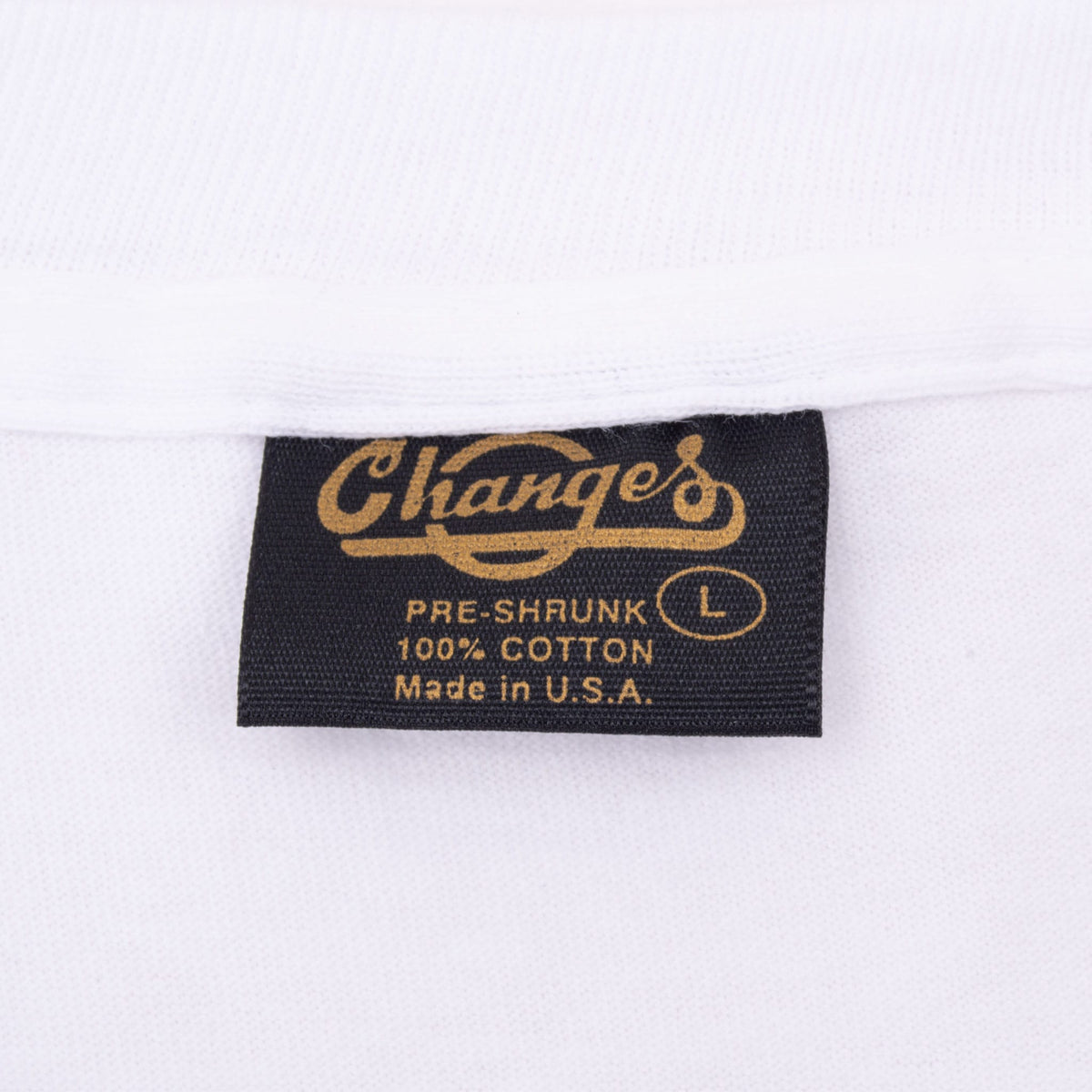 Change's neck label marked large, pre-shrunk 100% cotton and Made in U.S.A.