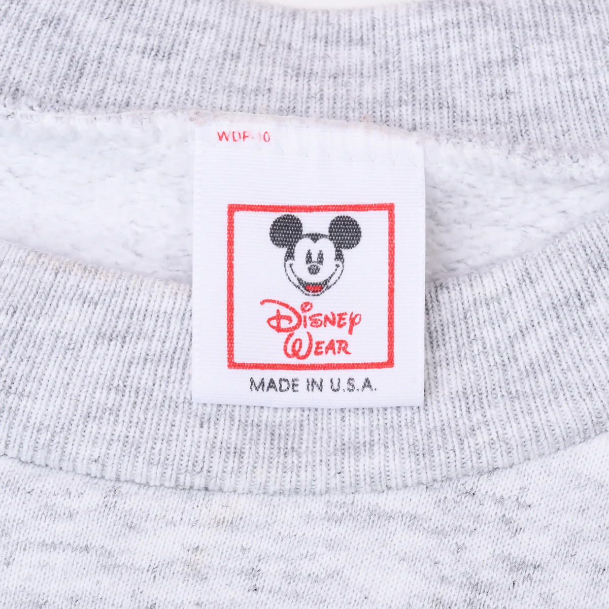 Disney Wear neck label with Mickey Mouse graphic and Made in U.S.A. text