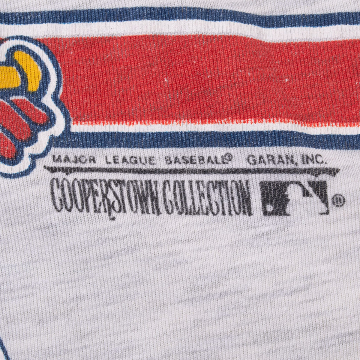 Cooperstown Collection and Major League Baseball print detail below a red and navy stripe