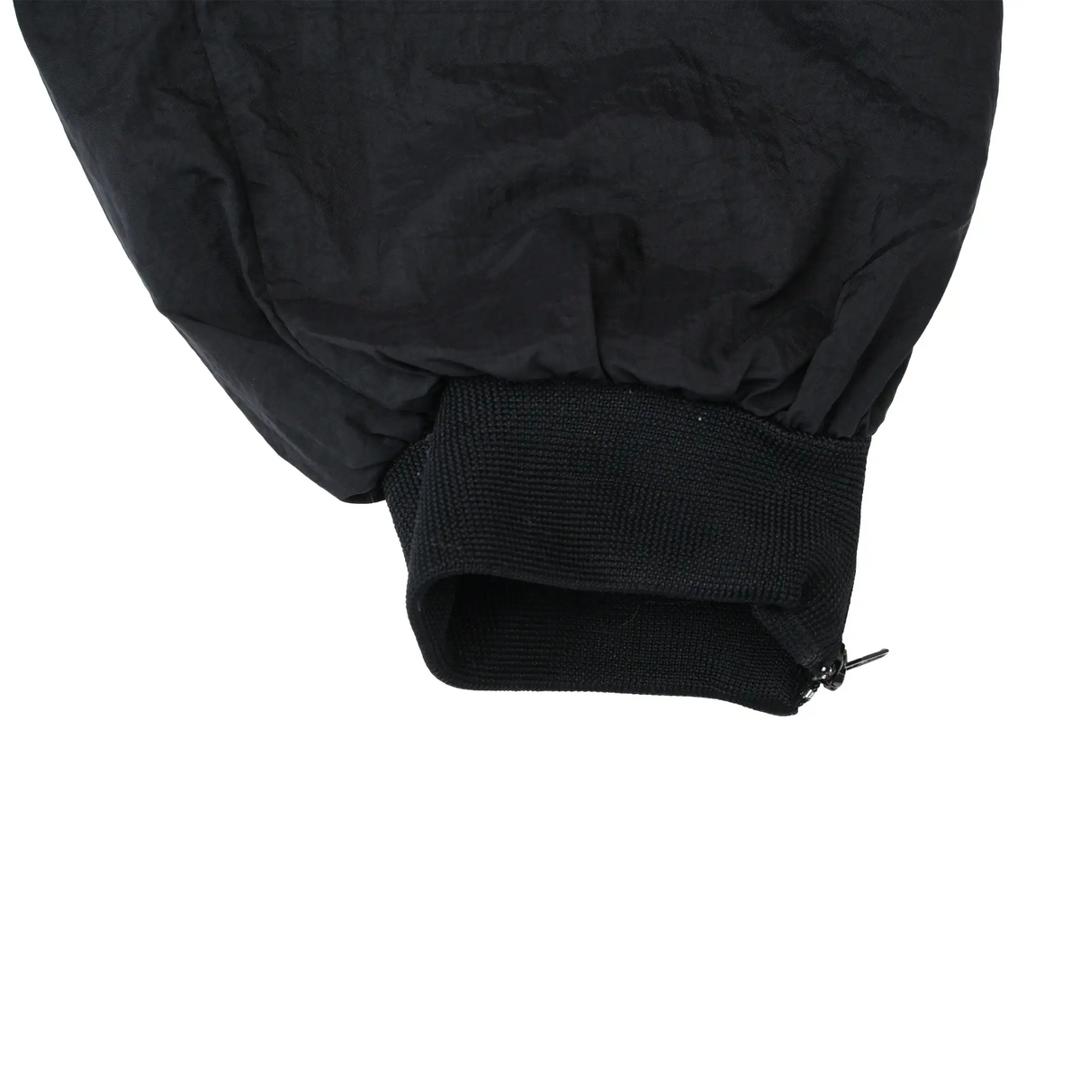 Close-up of black elastic ankle cuff and zipper detail