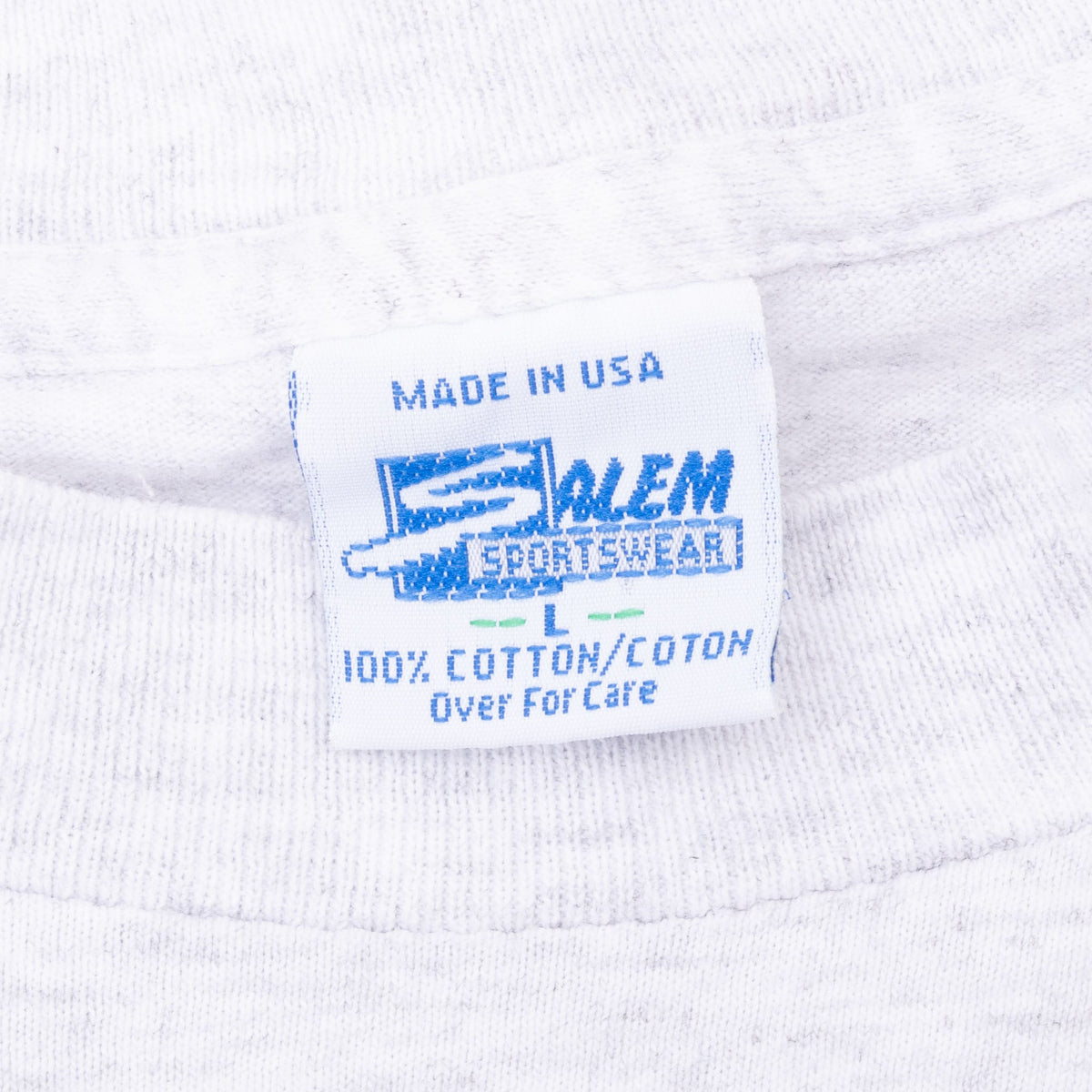 Neck tag on Michigan Wolverines T-shirt showing Salem Sportswear, Made in USA and cotton text