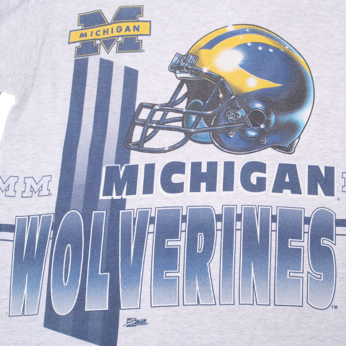 Close-up of back Michigan Wolverines print with maize-and-blue football helmet and block lettering