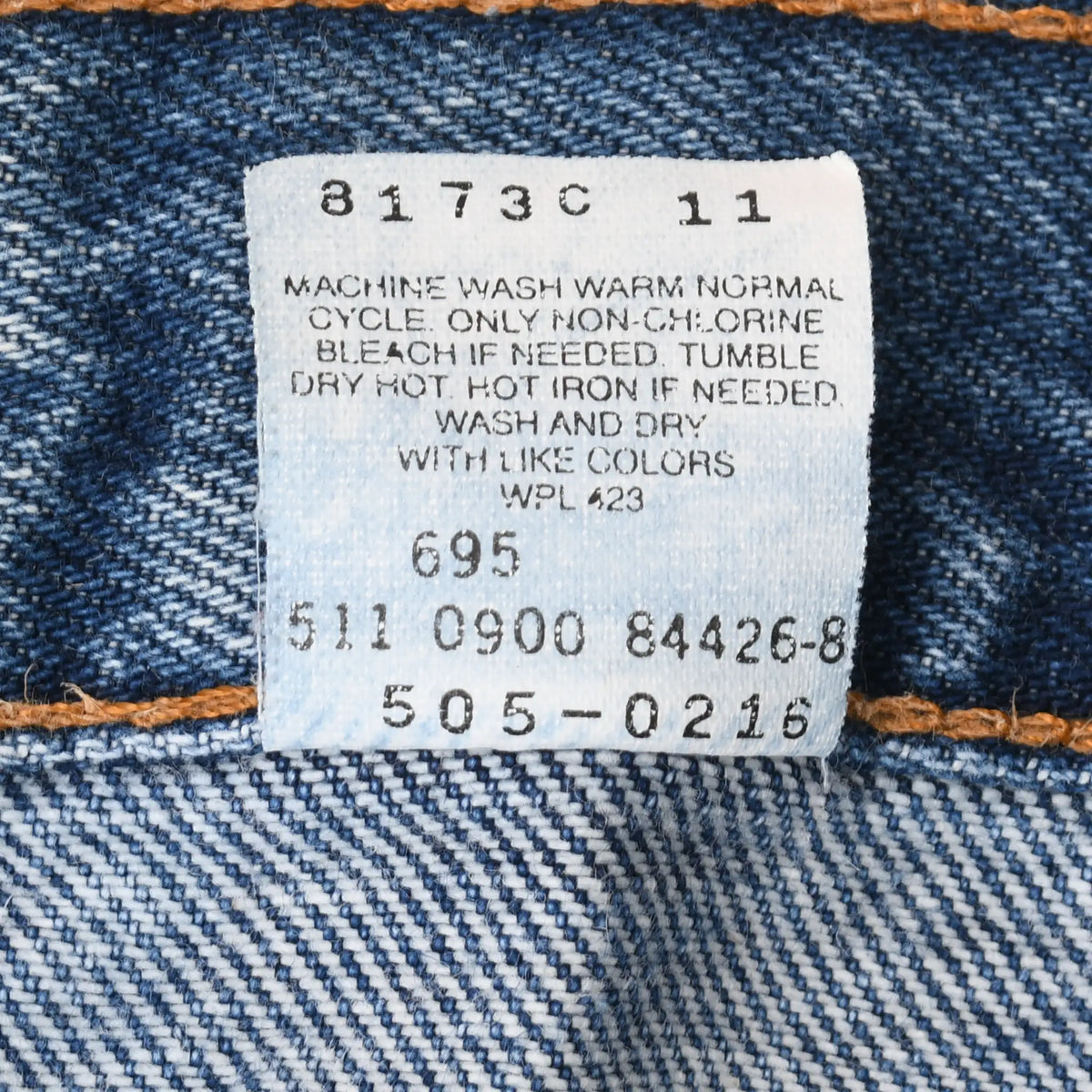 Close-up of reverse care label with washing instructions and Levi's 505 product codes