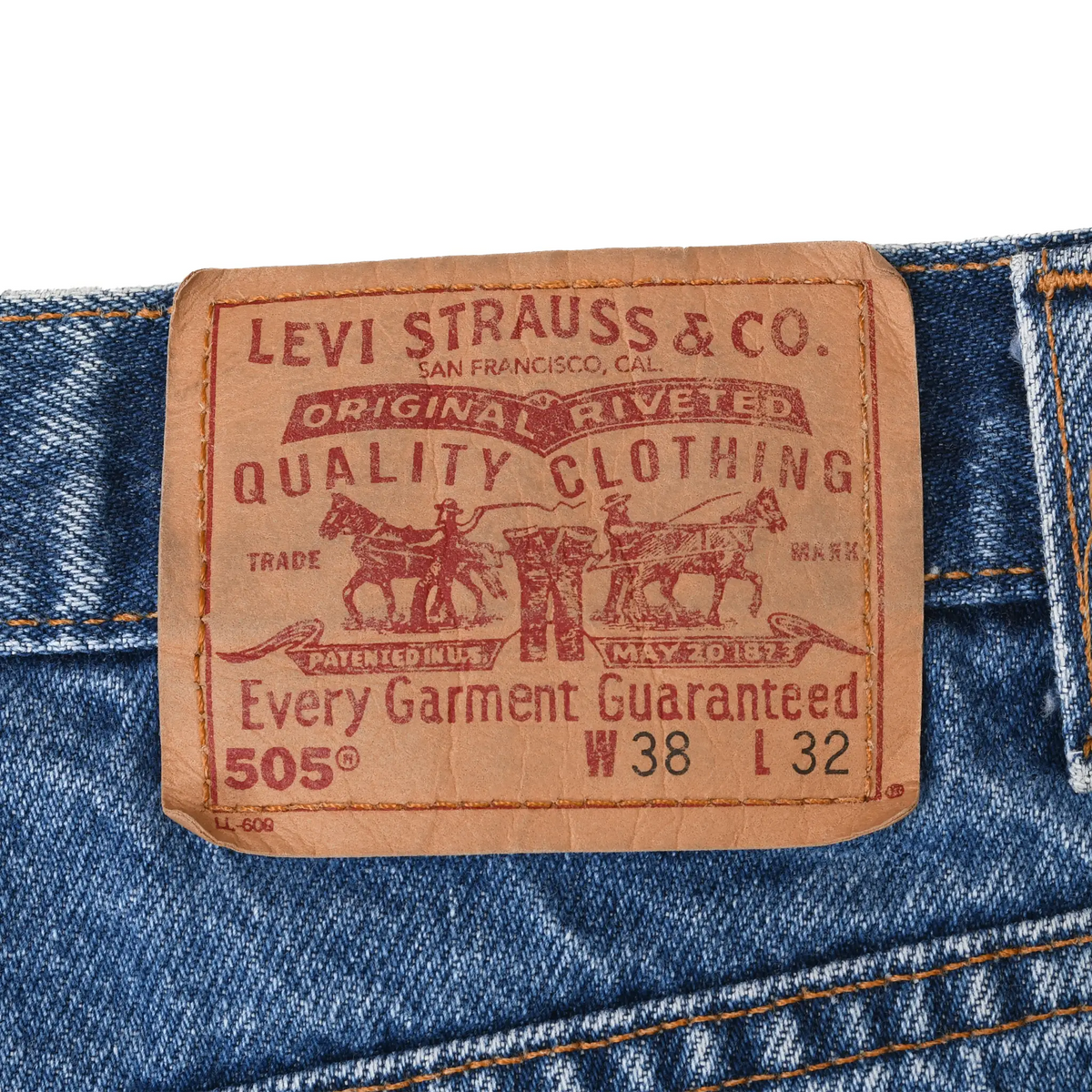 Close-up of tan Levi Strauss & Co. two-horse waistband patch marked 505, W38 L32