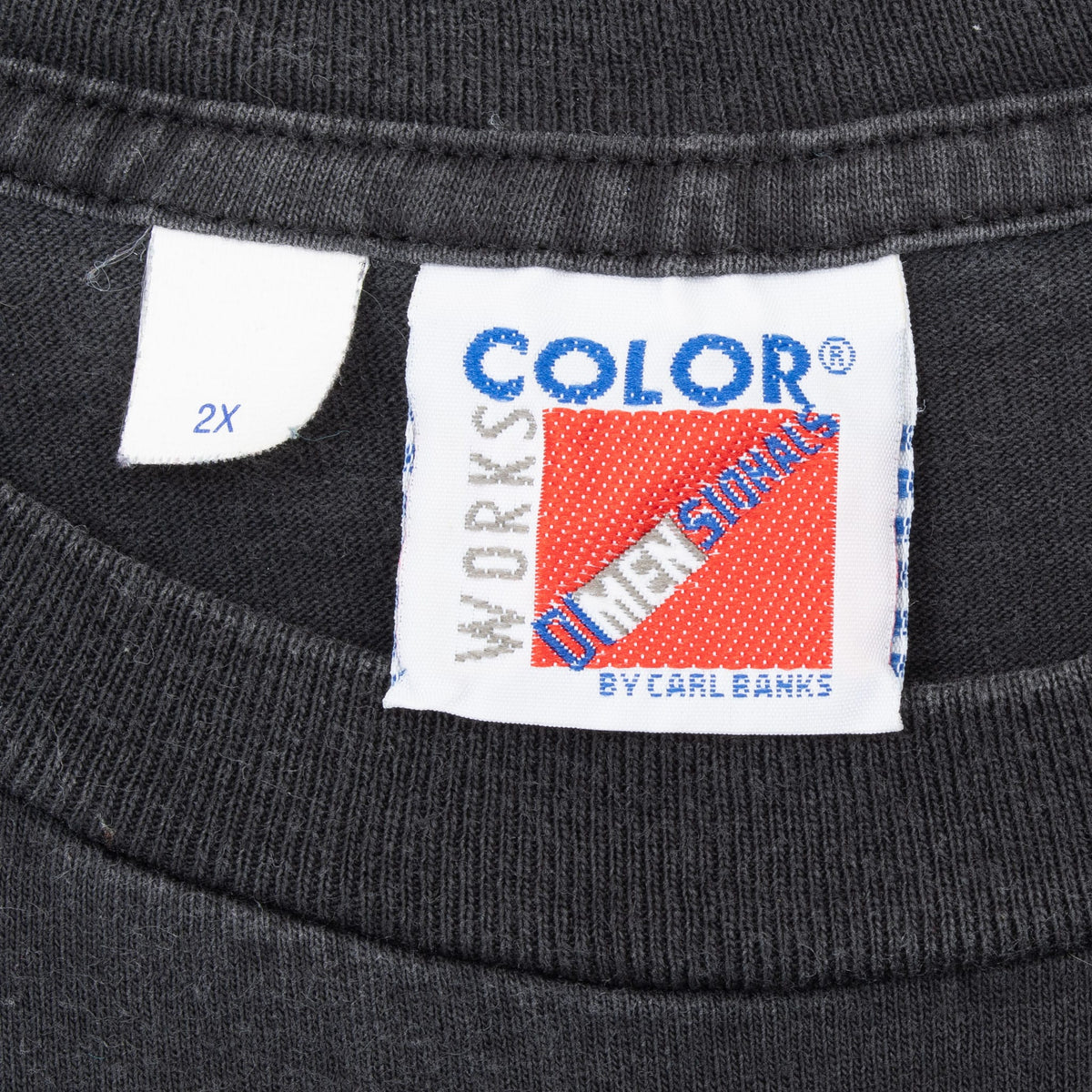 Close-up of Color Sportswear by Lee garment label and 2X size tag inside collar