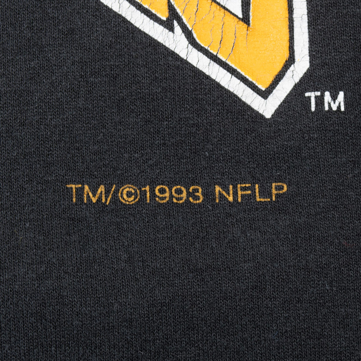 Close-up of TM and 1993 NFLP copyright print beneath the Pittsburgh Steelers graphic