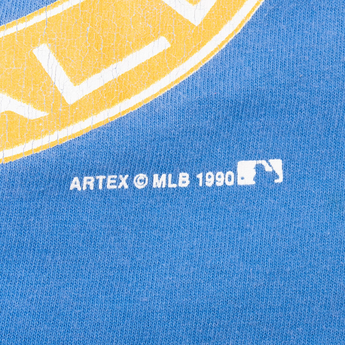 Close-up of Artex MLB 1990 mark on the printed graphic