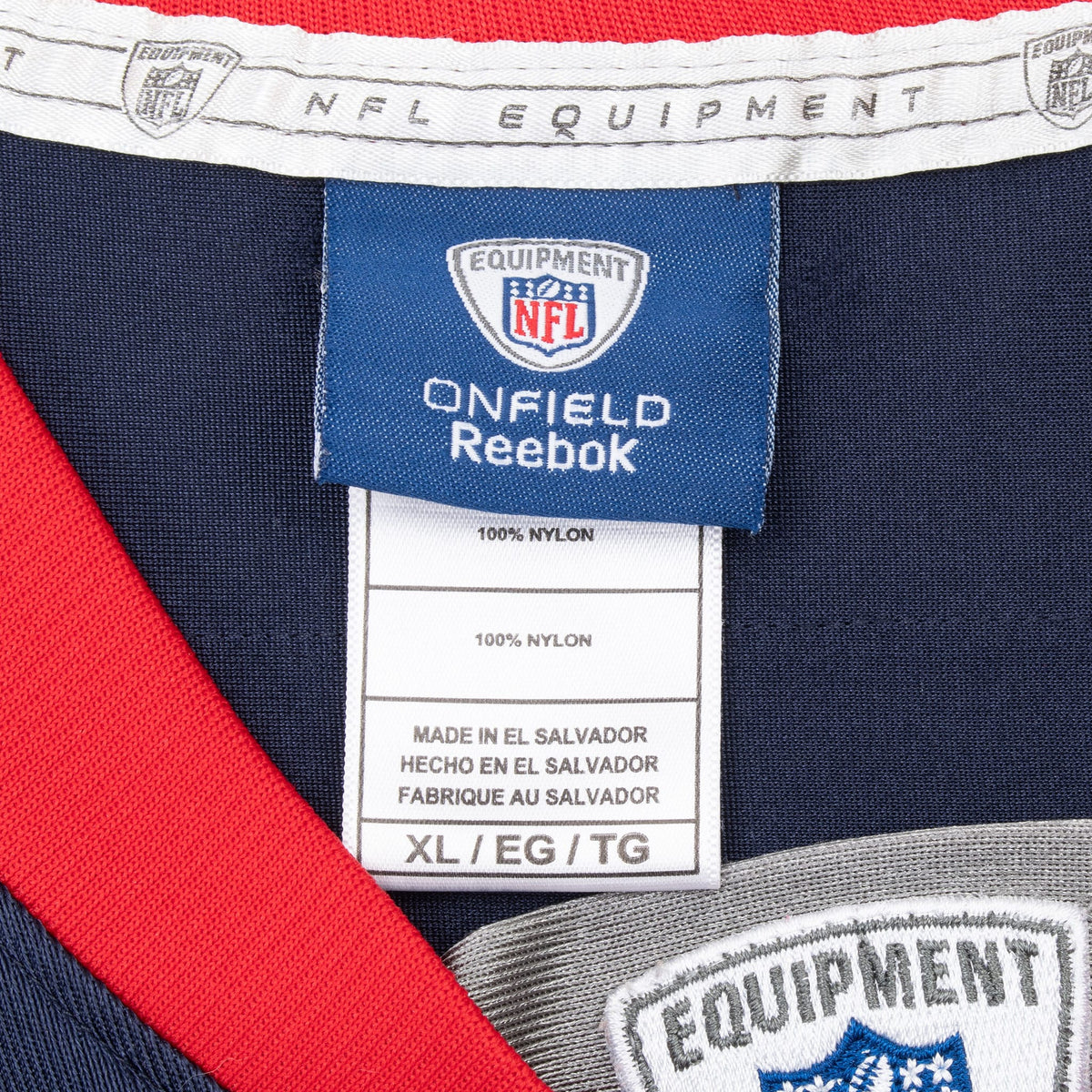 Reebok NFL Equipment neck tag and size XL label inside navy jersey