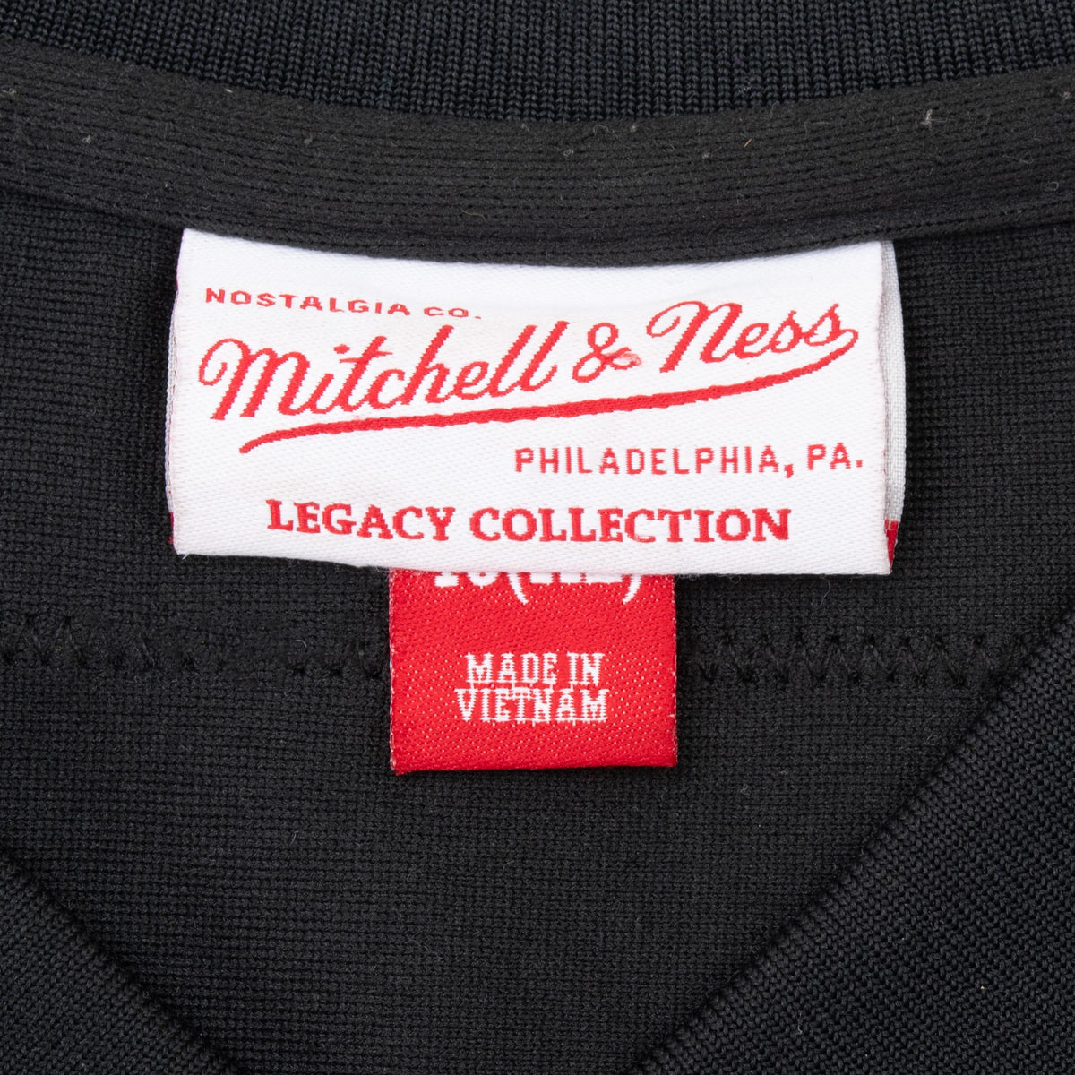Mitchell & Ness Legacy Collection neck label and XL size tag