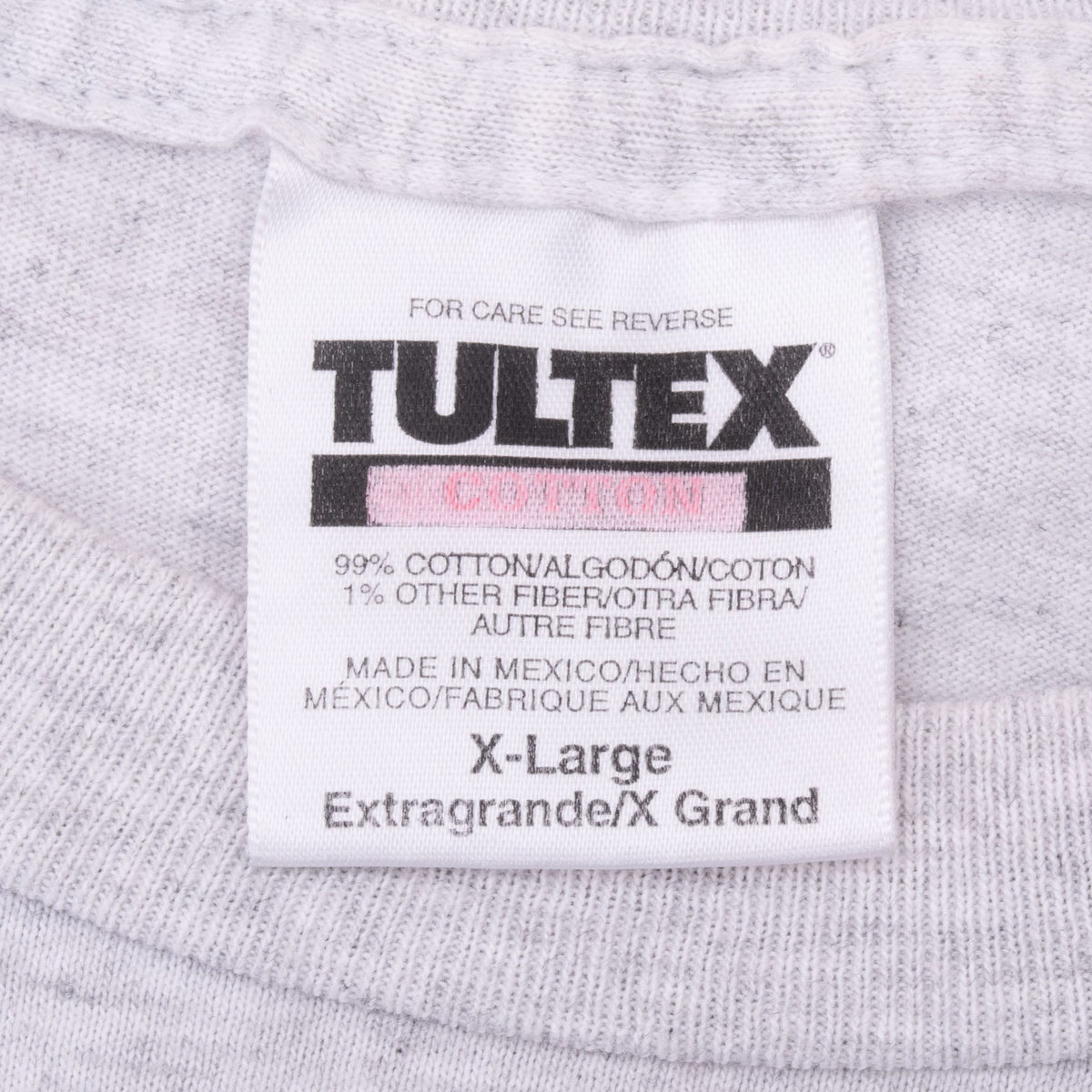 Close-up of Tultex X-Large neck label on light gray T-shirt