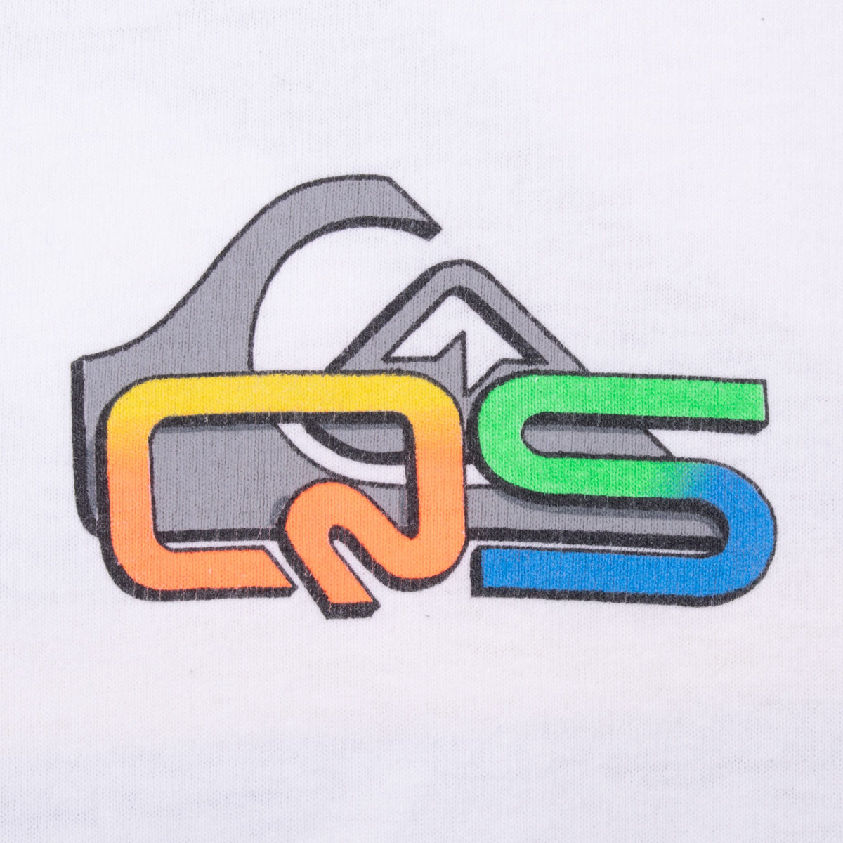 Close-up of small multicolor Quiksilver chest graphic on white fabric