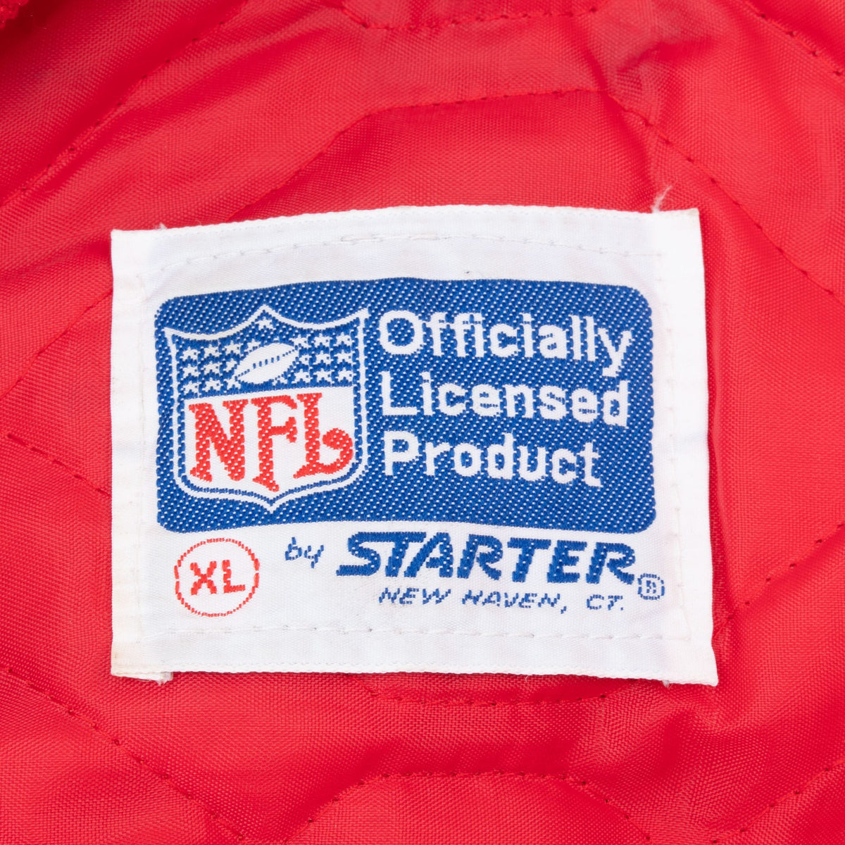 NFL officially licensed Starter label marked XL on red quilted jacket lining