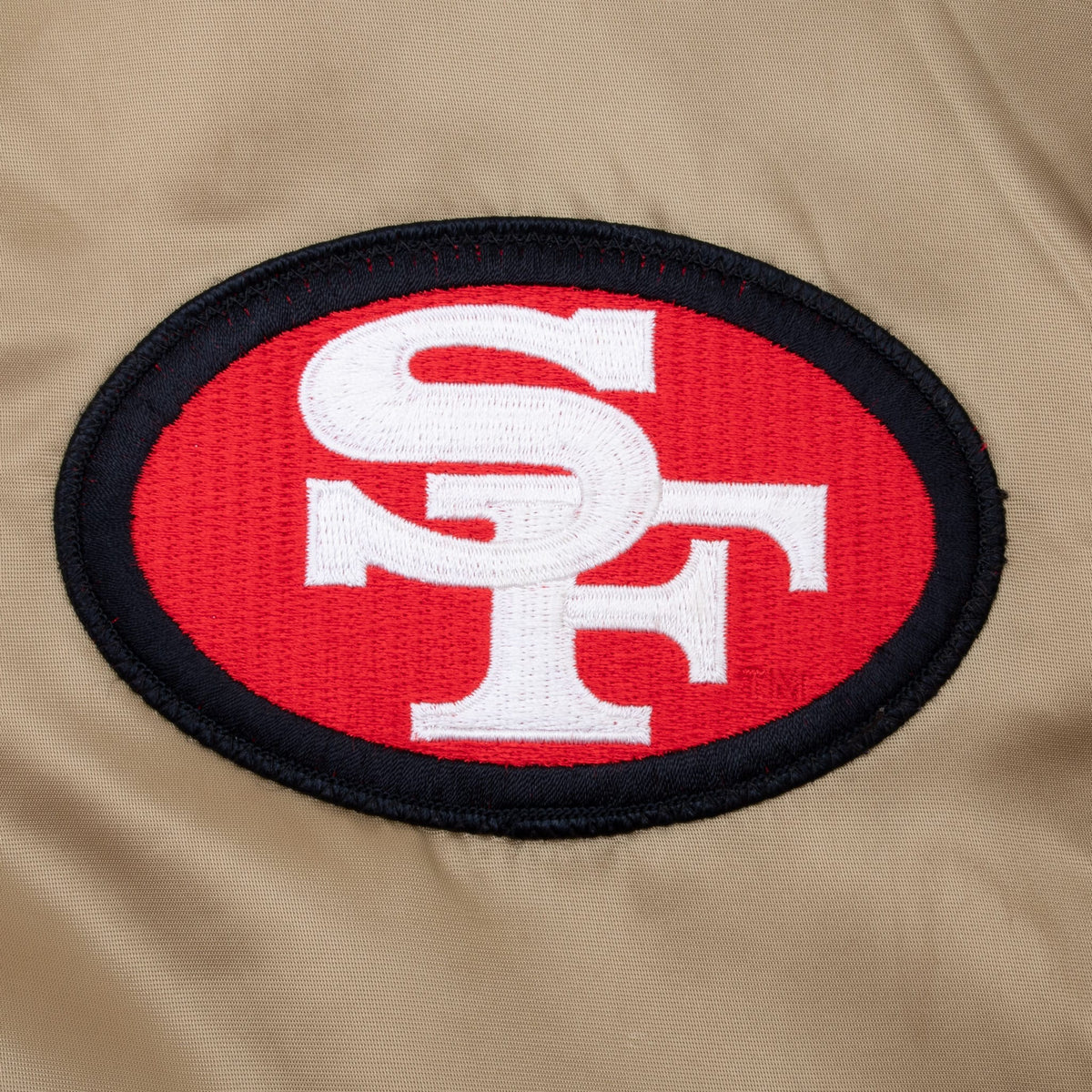 Close-up of embroidered San Francisco 49ers oval chest logo patch