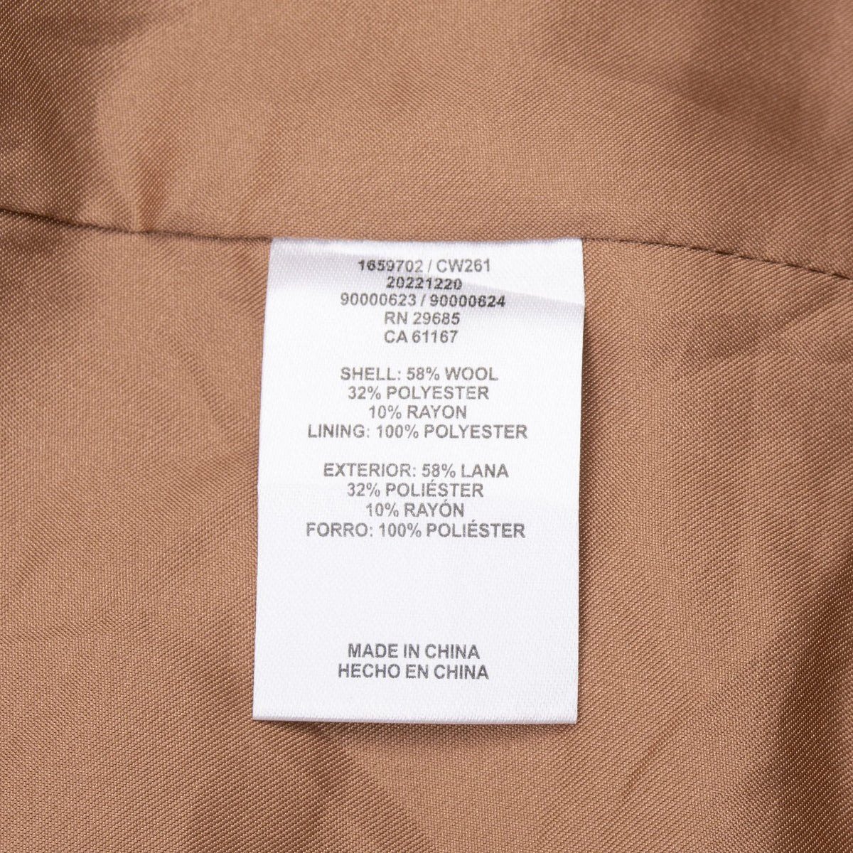 Close-up of Pendleton coat fiber content and care label on brown lining