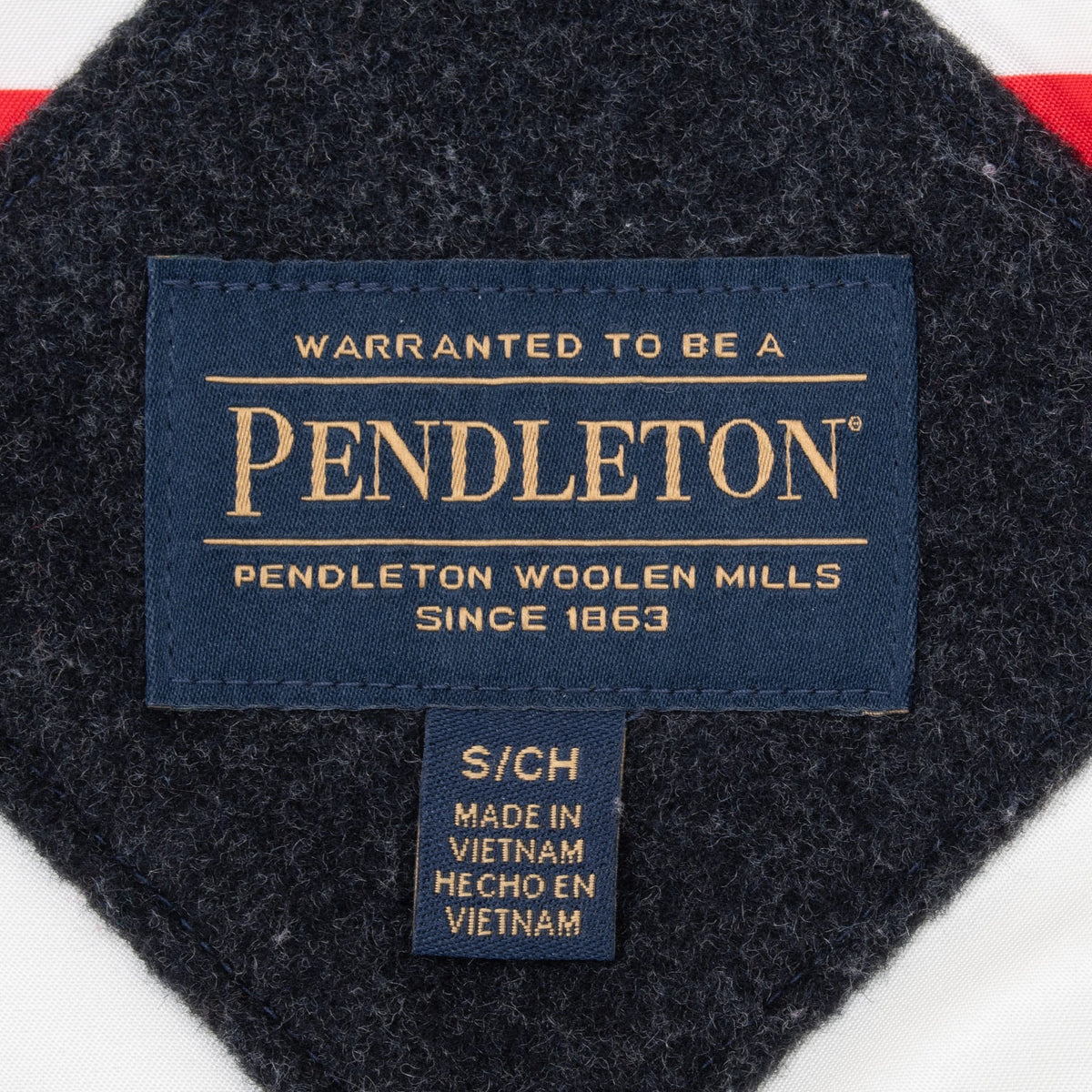 Close-up of Pendleton Woolen Mills brand label and Made in Vietnam tag