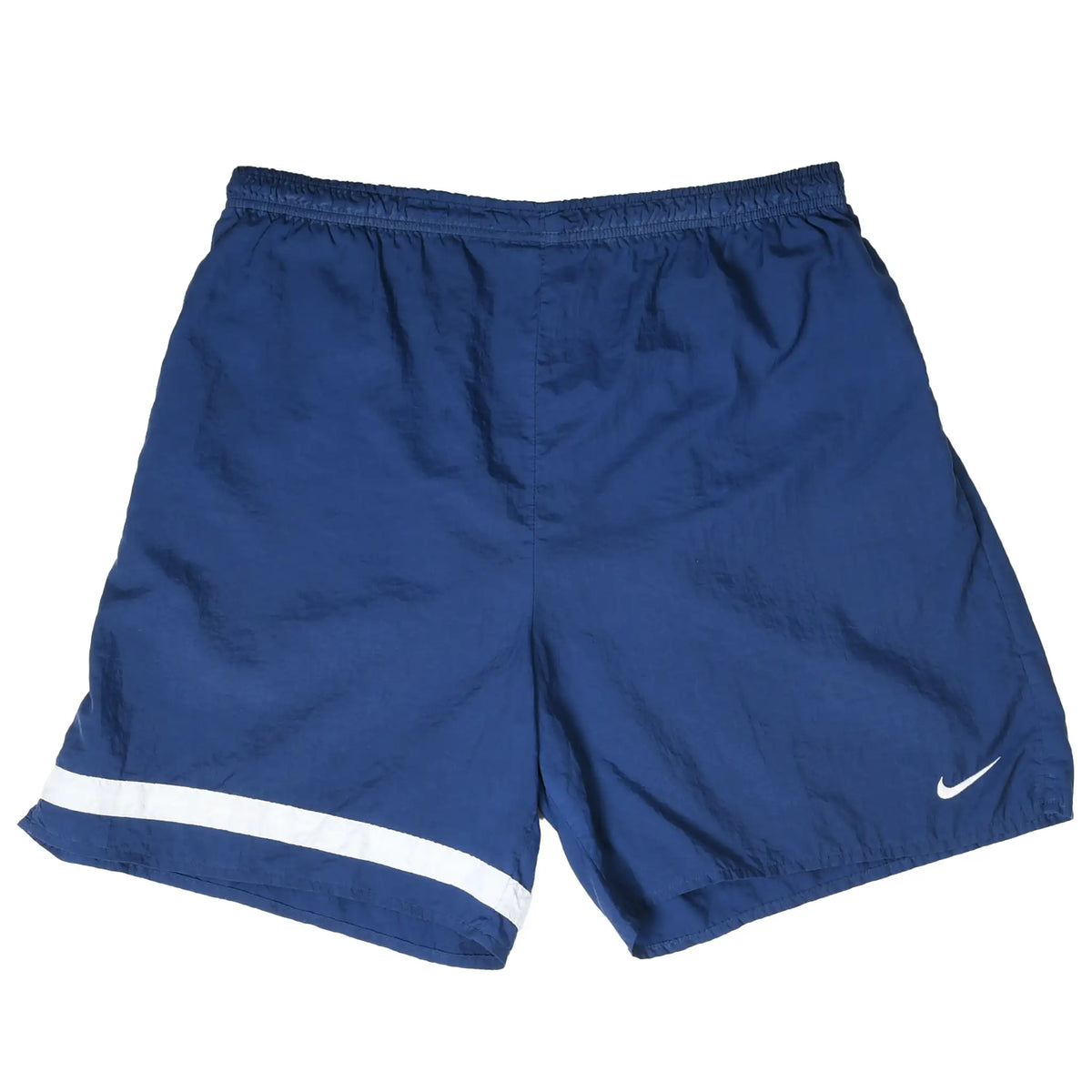 Front of navy blue Nike shorts with white Swoosh and curved stripe detail