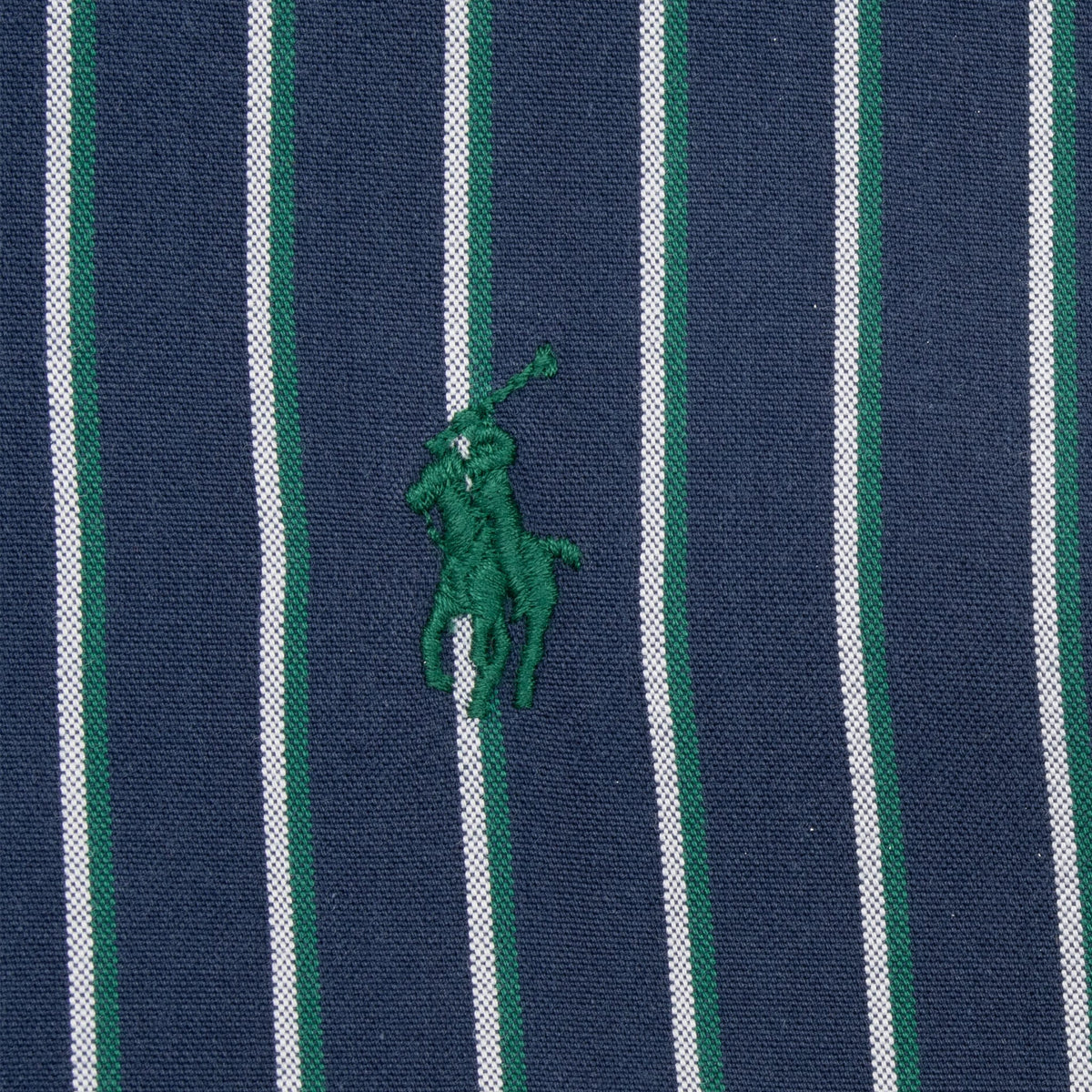 Green embroidered Polo pony on blue, white and green striped fabric