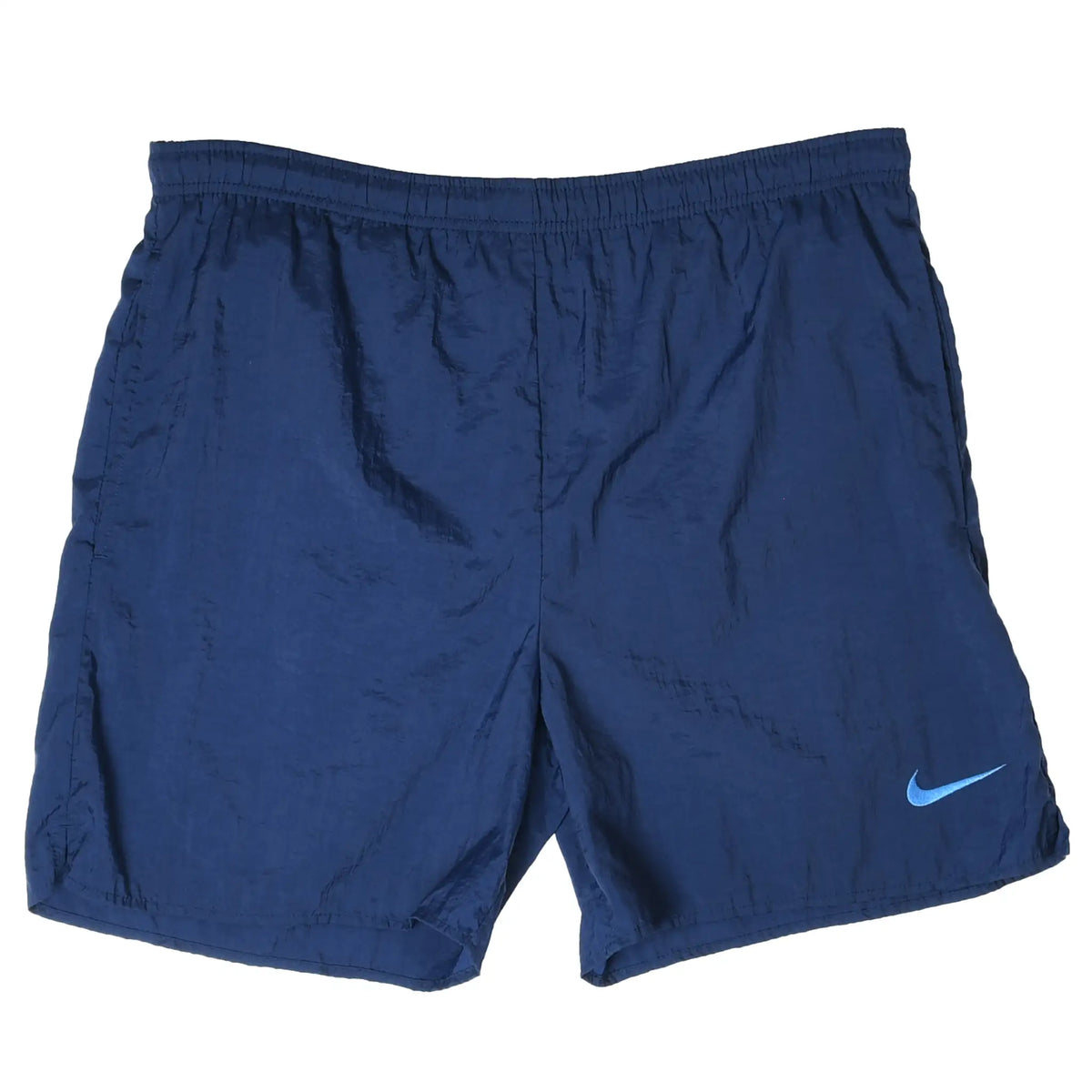 Front of navy blue Nike swim trunks with elastic waist and small light blue embroidered Swoosh