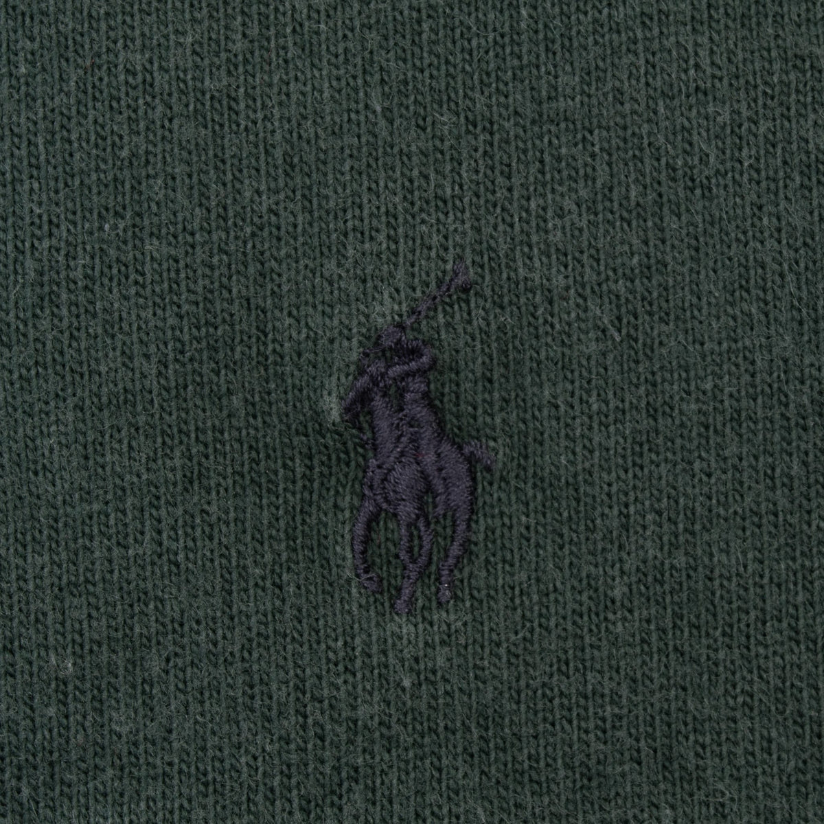 Close-up of dark Polo pony embroidery on the green chest stripe